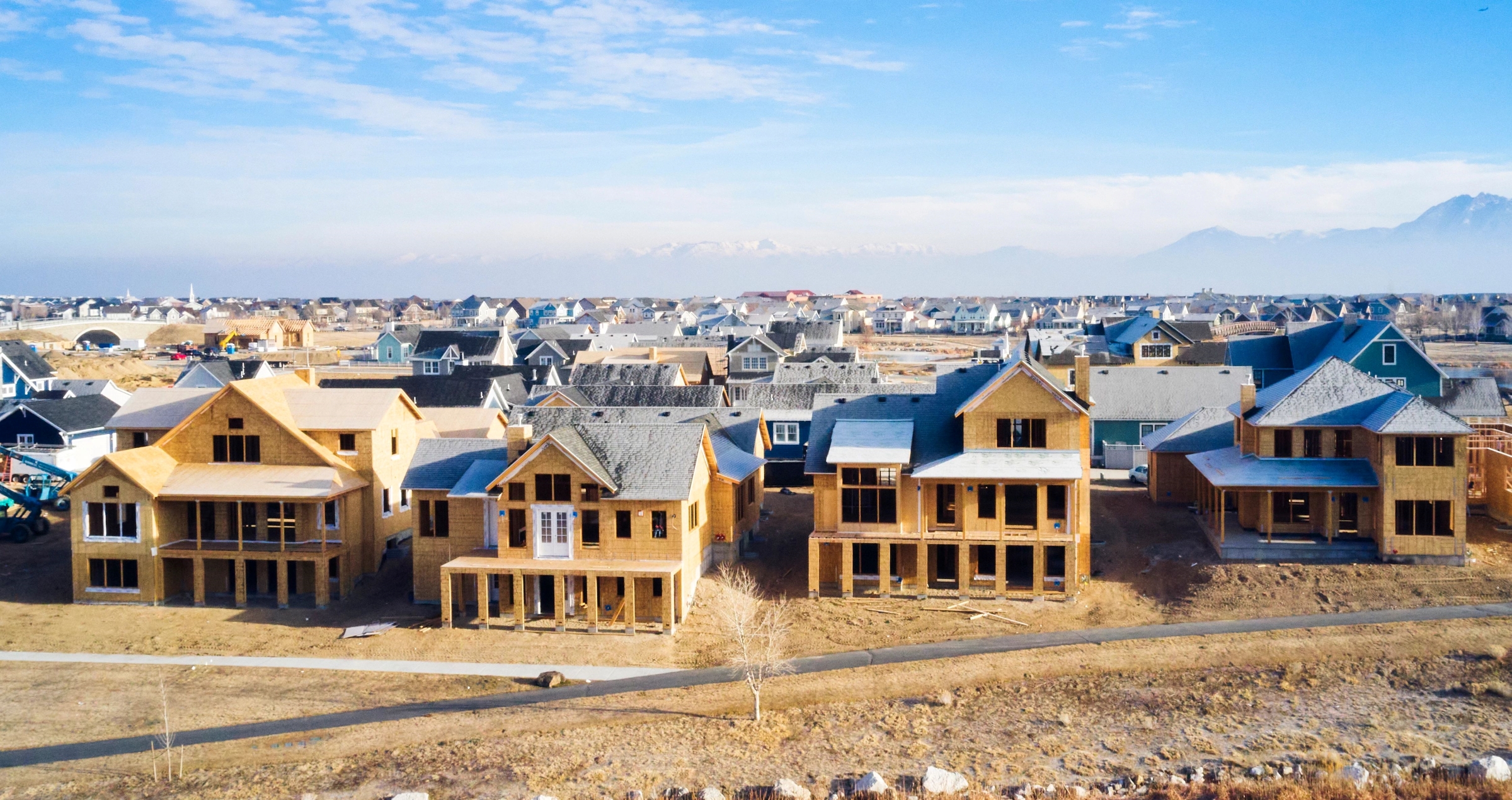 Single-family housing construction's percentage gains trailed those of new multifamily projects in May, the government reported. (Getty Images)