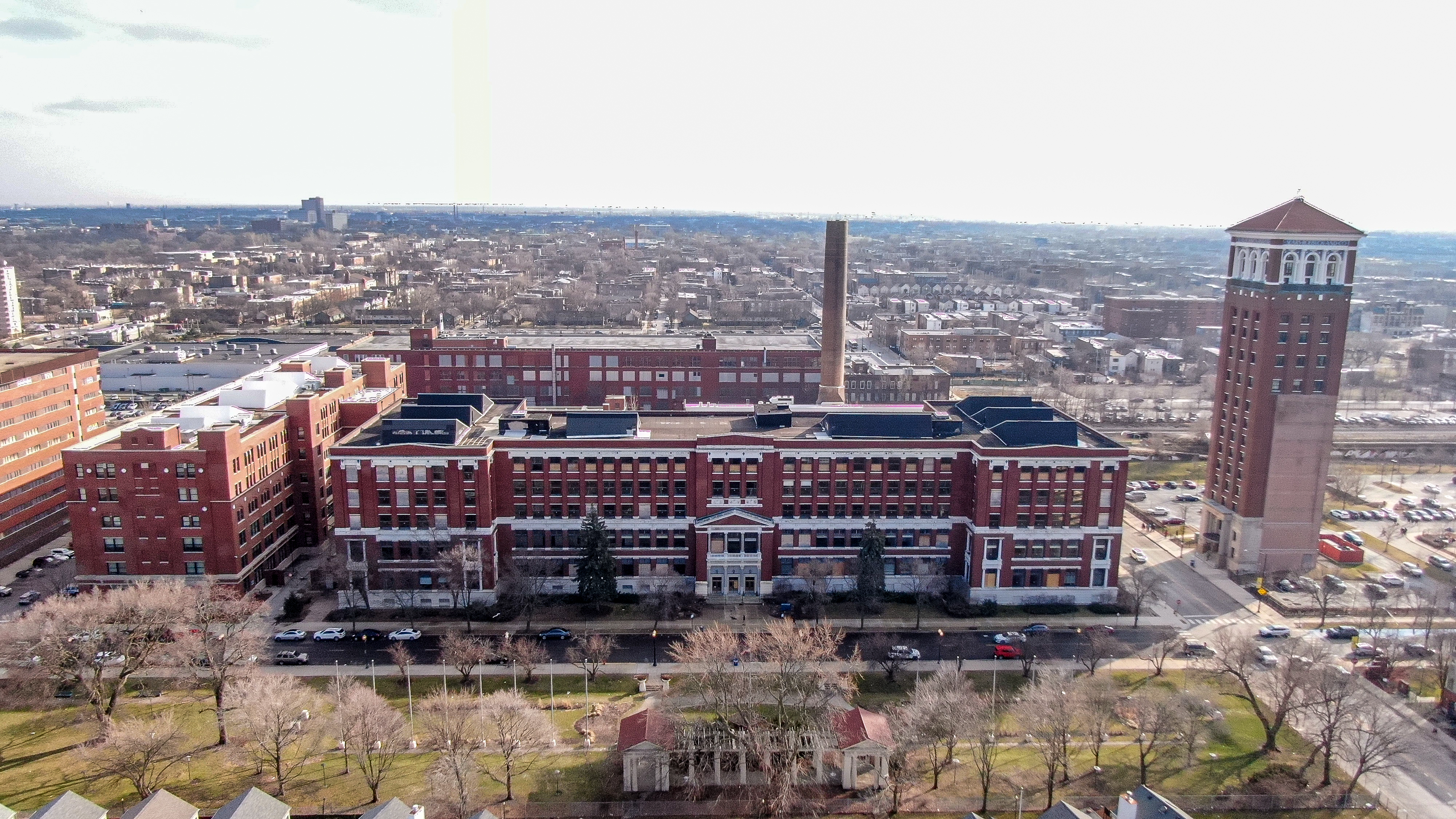 Former Sears buildings and, at right, former Allstate Insurance tower in Chicago’s Homan Square are for sale in a potential residential redevelopment play. (Dot Productions)