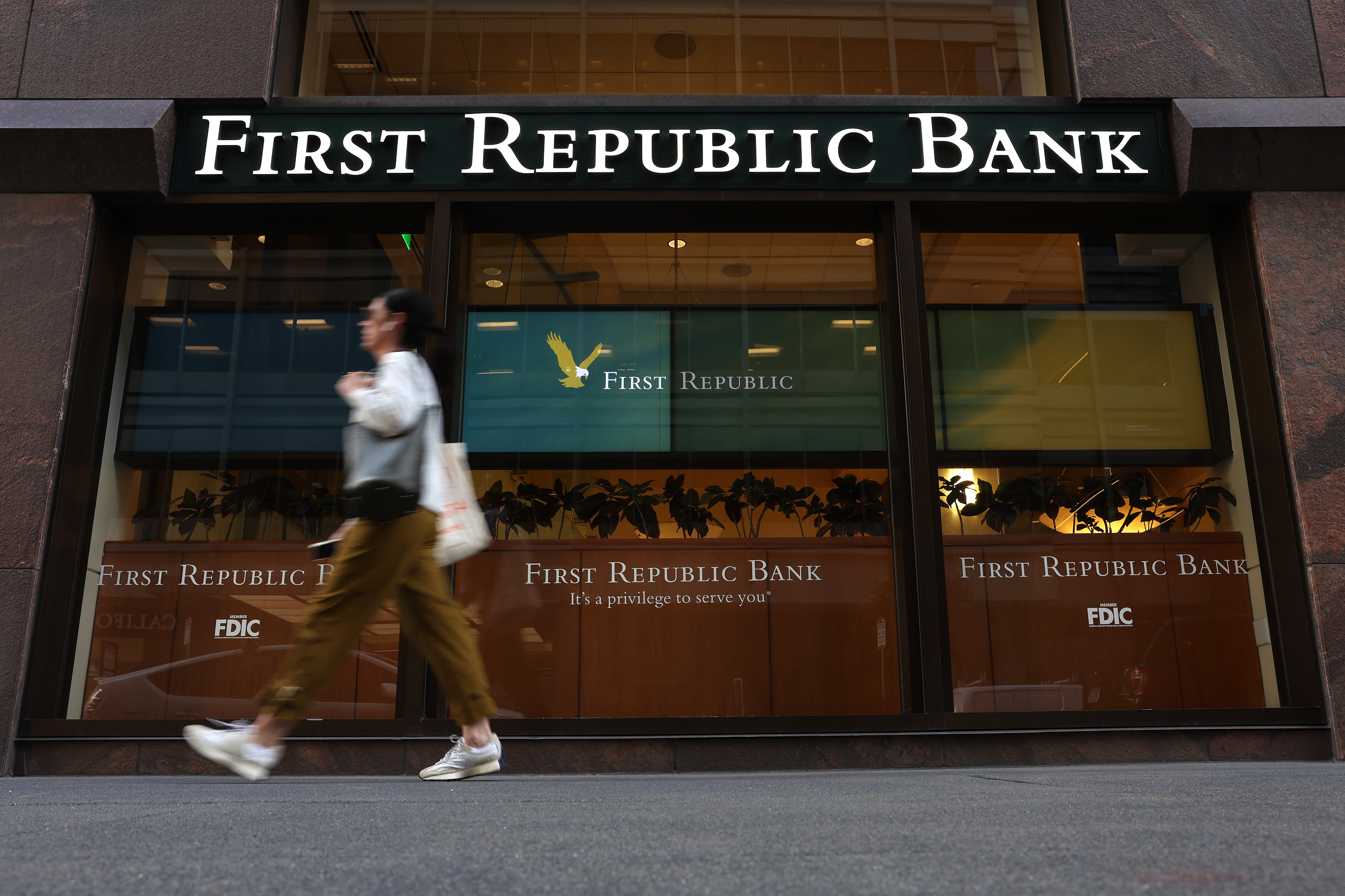 A pedestrian walks by a First Republic bank in San Francisco, California. (Justin Sullivan/Getty Images)