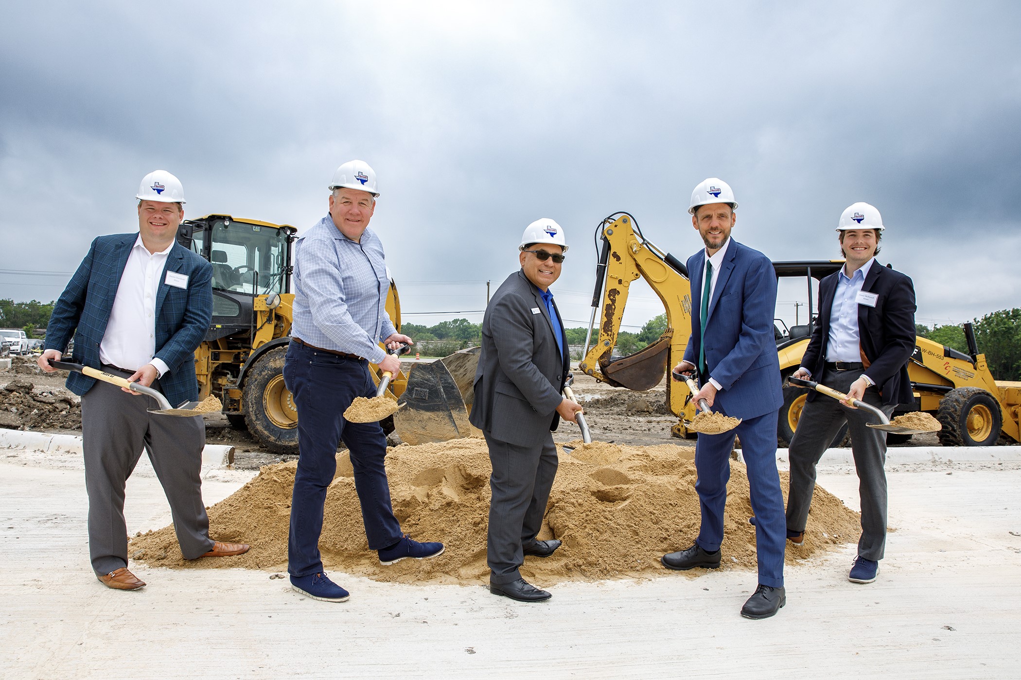 Hines and Terrell, Texas, officials celebrate the groundbreaking of Northspur. From left: Dustin Davidson of Hines; Rob Witte of Hines; Rick Carmona, mayor of Terrell; Mike Sims, city manager of Terrell; and Greer McDowell of Hines. (Hines)