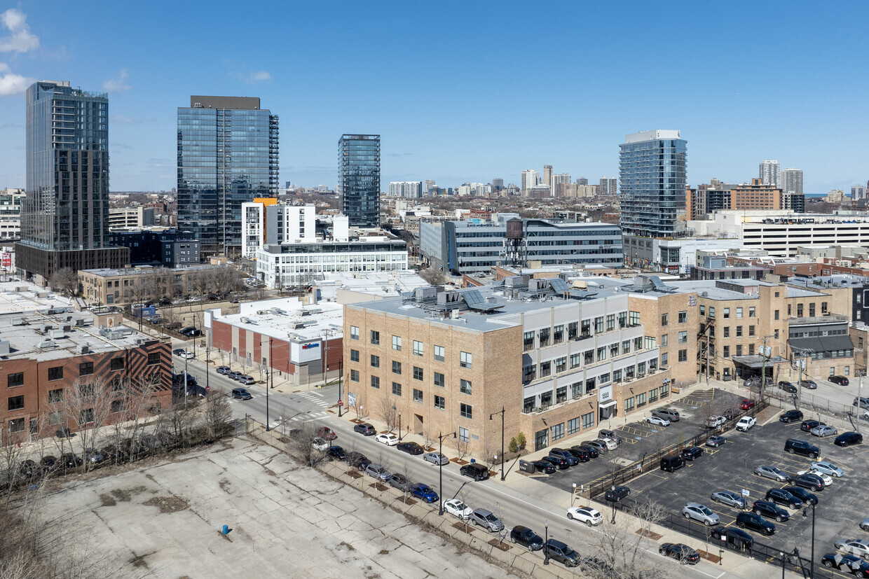 Owners of the boutique office building at 1333 N. Kingsbury St. in Chicago are proposing a 23-story residential tower on a surface lot next door. (Justin Schmidt/CoStar)