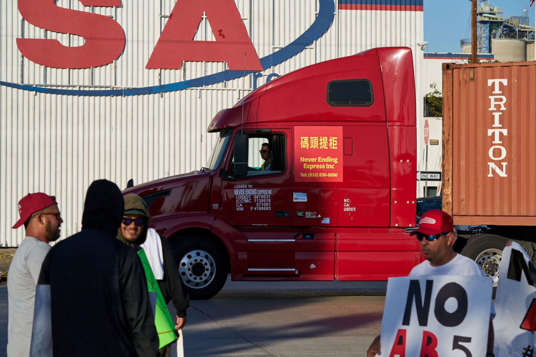 Truckers opposing a California law imposing new regulations for independent contractors protested Wednesday outside the Port of Long Beach near Los Angeles. (Bloomberg via Getty Images)