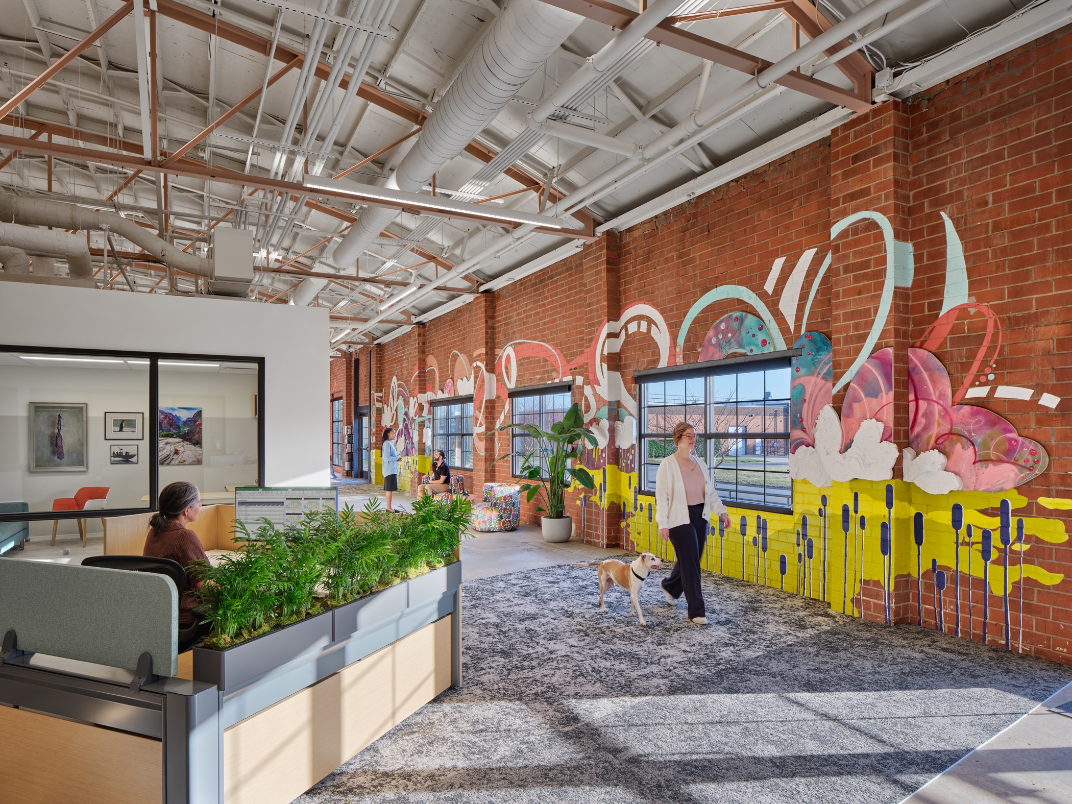 The Charlotte office for law firm Gardner Skelton was designed to be friendly to dogs and has a brightly colored mural painted on an interior wall. (Halkin Mason Photography) 