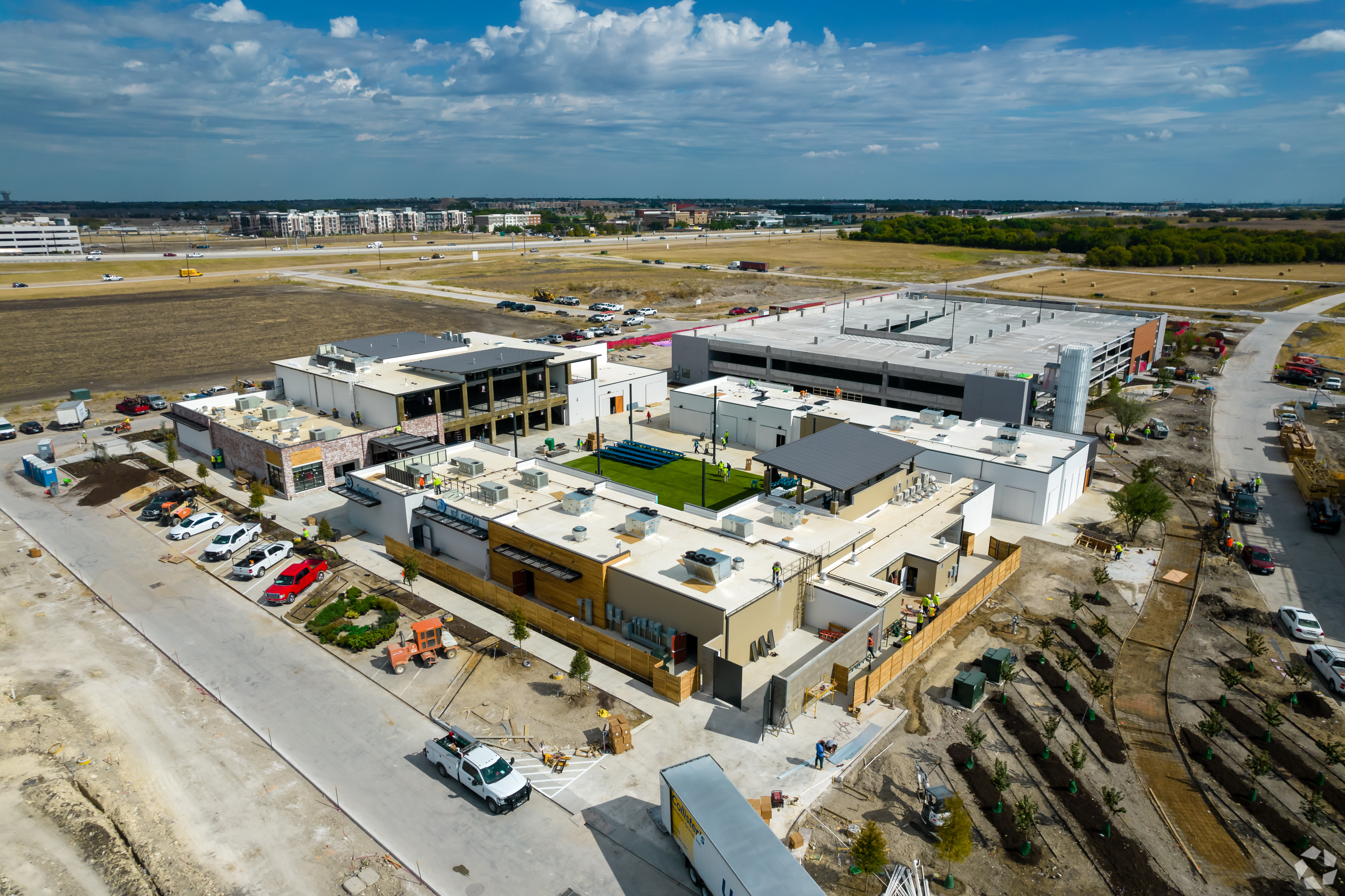 The Farm at Allen is under construction, bringing a new mixed-use development to a Dallas-area suburb. This picture was taken last October. (CoStar)