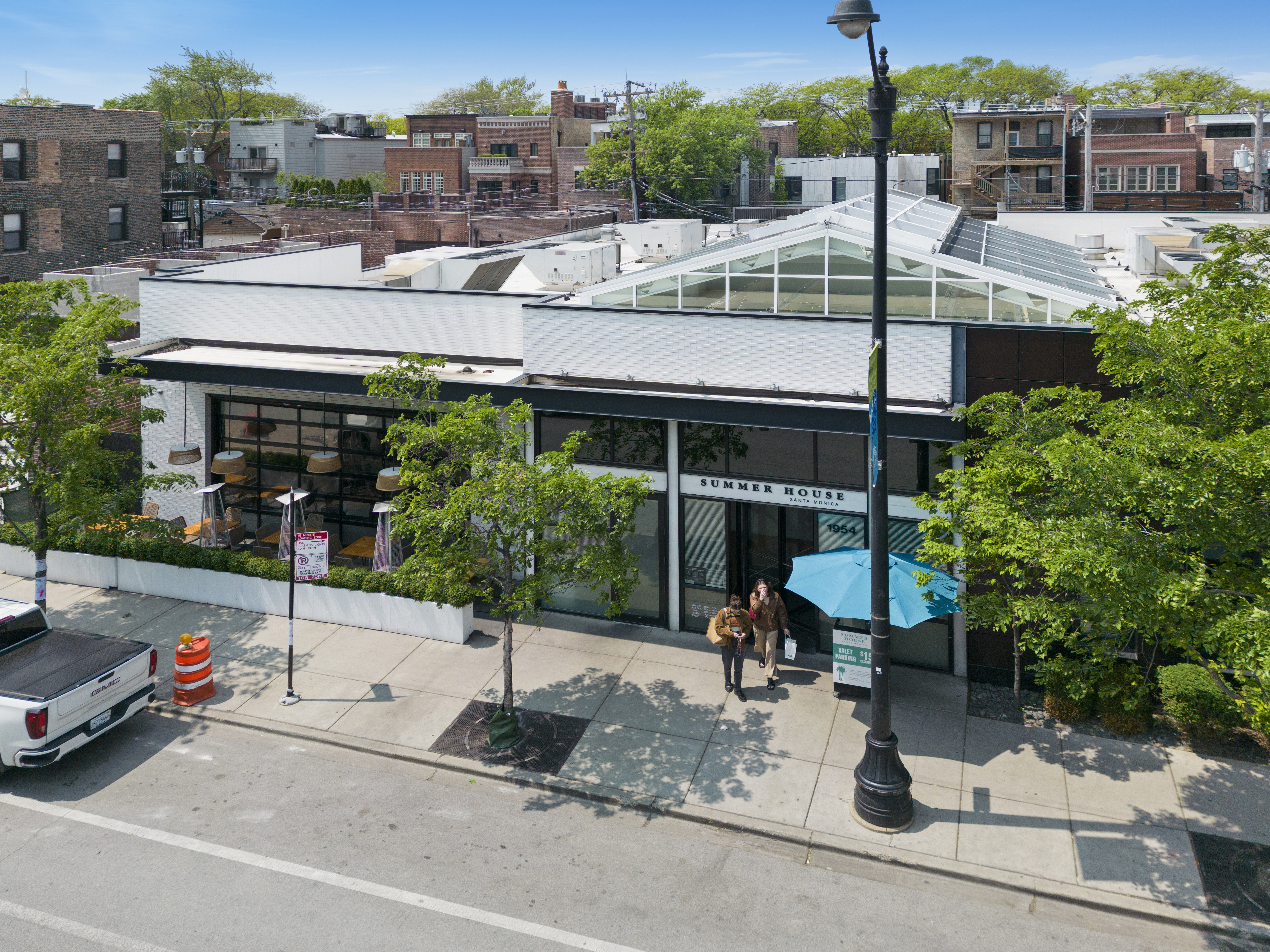 Asana Partners has acquired 16 retail spaces on Chicago's North Side, including one that is home to the popular Summer House Santa Monica restaurant at 1954 N. Halsted St. (Mid-America Real Estate)