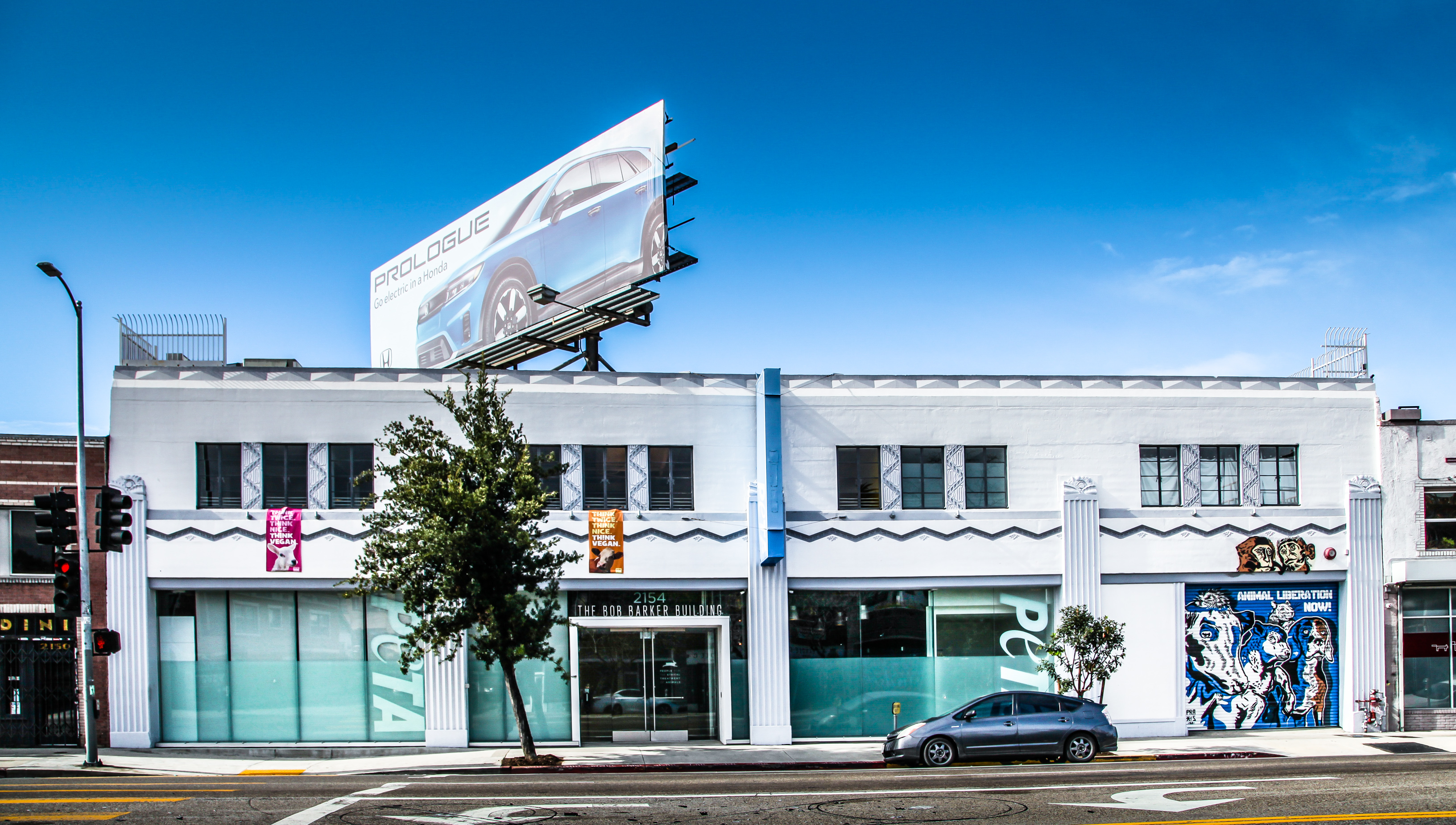 The Echo Park building is being marketed as an owner-user opportunity with architectural distinction and potential revenue from a Clear Channel billboard lease that expires in 2026. (CoStar)
