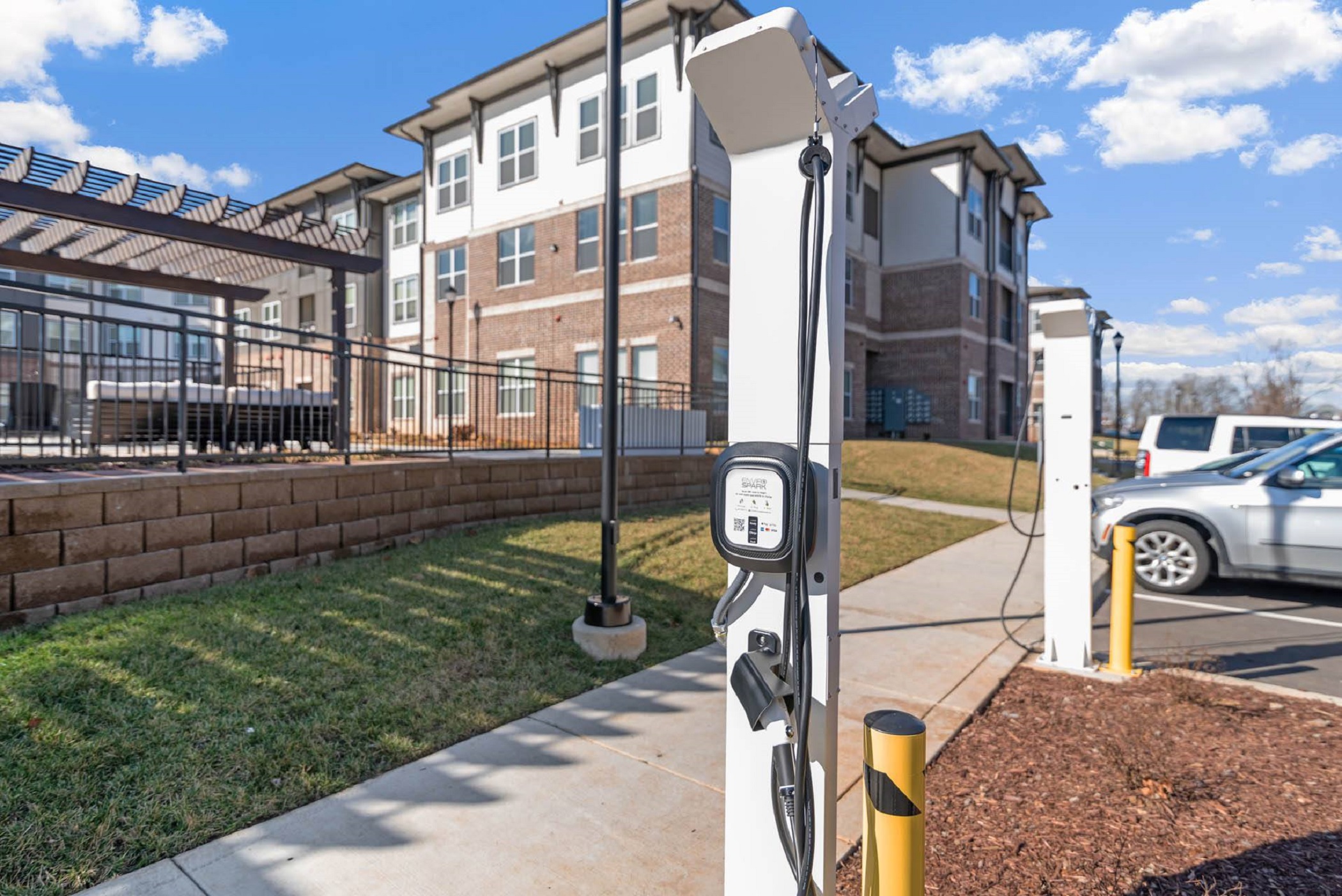 EnviroSpark installed these electric vehicle chargers at Wood Partners' recently opened  multifamily development Alta Depot in Smyrna, Tennessee. (CoStar)