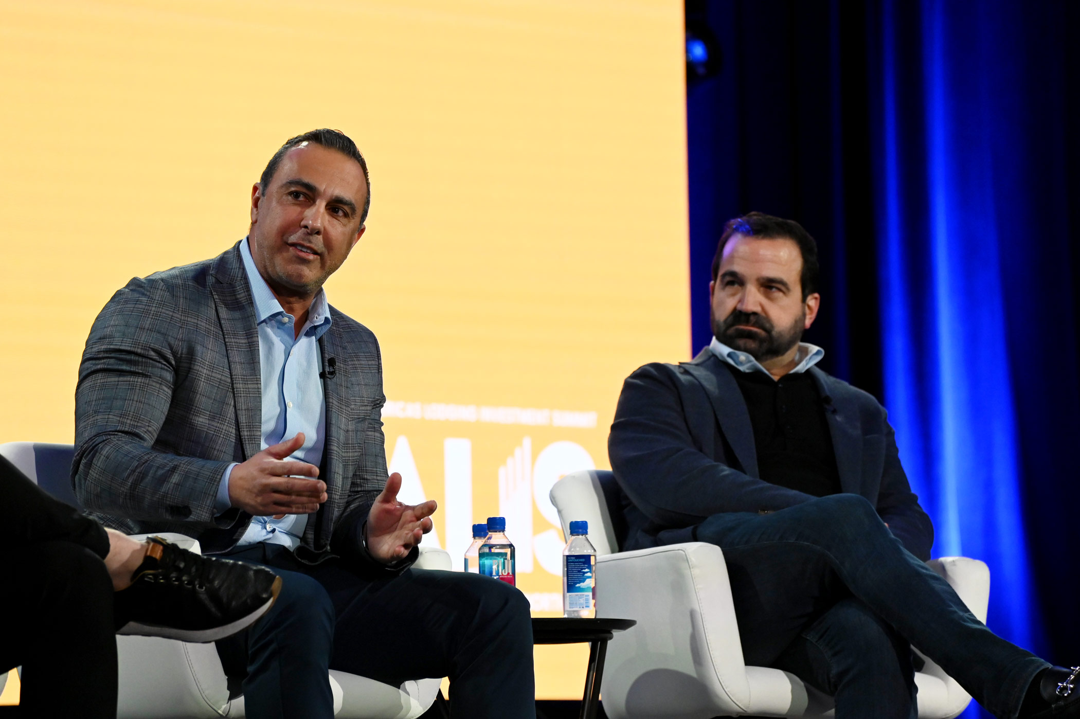 Red Roof's Zack Gharib (left), and Rockbridge's Jim Merkel speak at the 2025 Americas Lodging Investment Summit. (Bryan Wroten)