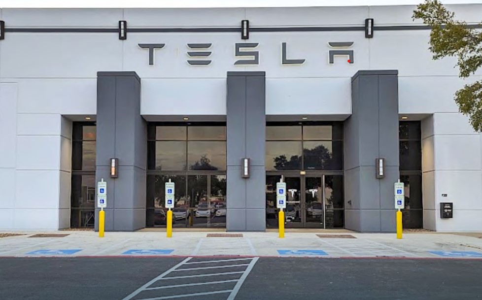 The 35,616-square-foot Tesla Collision Center between Irvine and Newport Beach drew bids from a wide range of investors. (SRS Capital Markets)