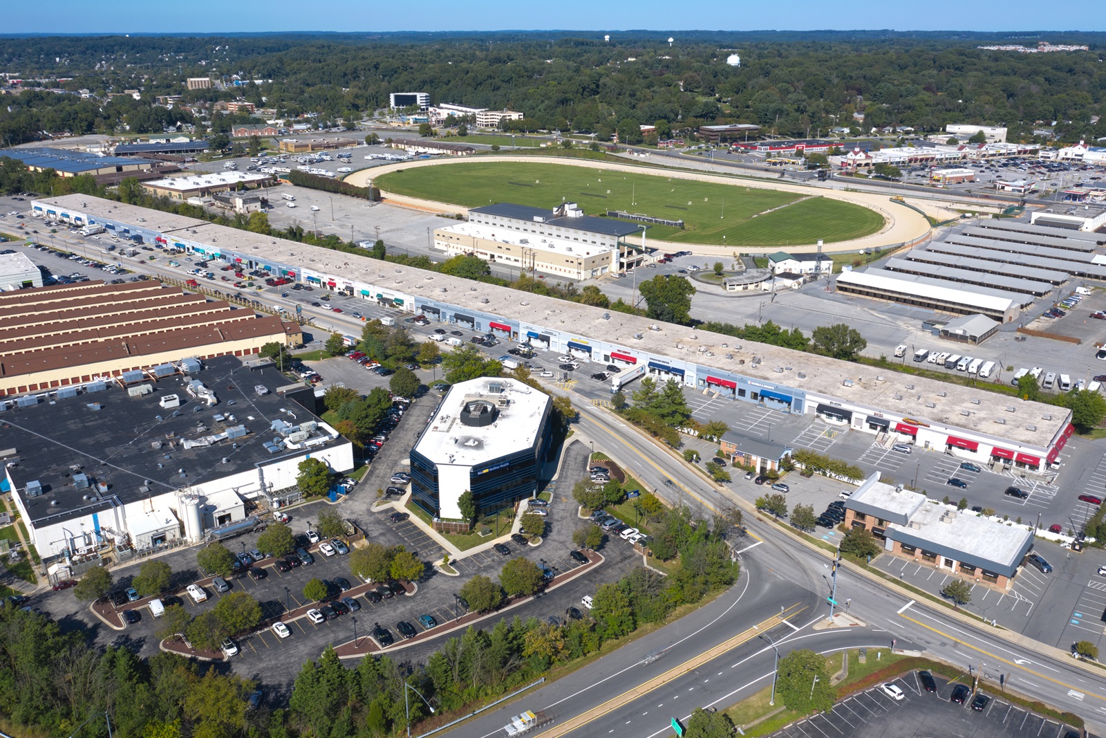 Baltimore Pickleball Club signed a lease to open an indoor pickleball venue at Timonium Exchange, a long, narrow complex with colorful awnings. (CoStar)
