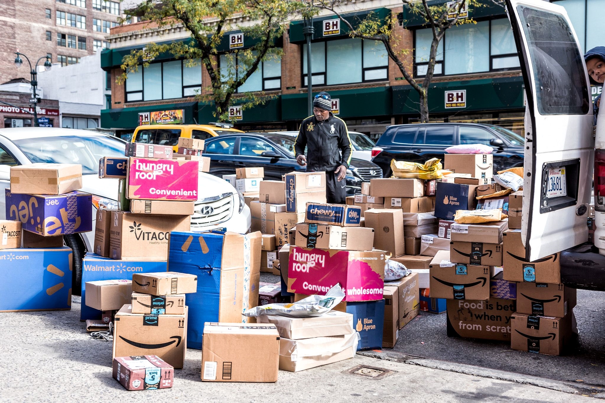 A global survey found package delivery drivers under increased pressure to bring more parcels to more places per hour while assuming added duties including identity verification. (Getty Images)