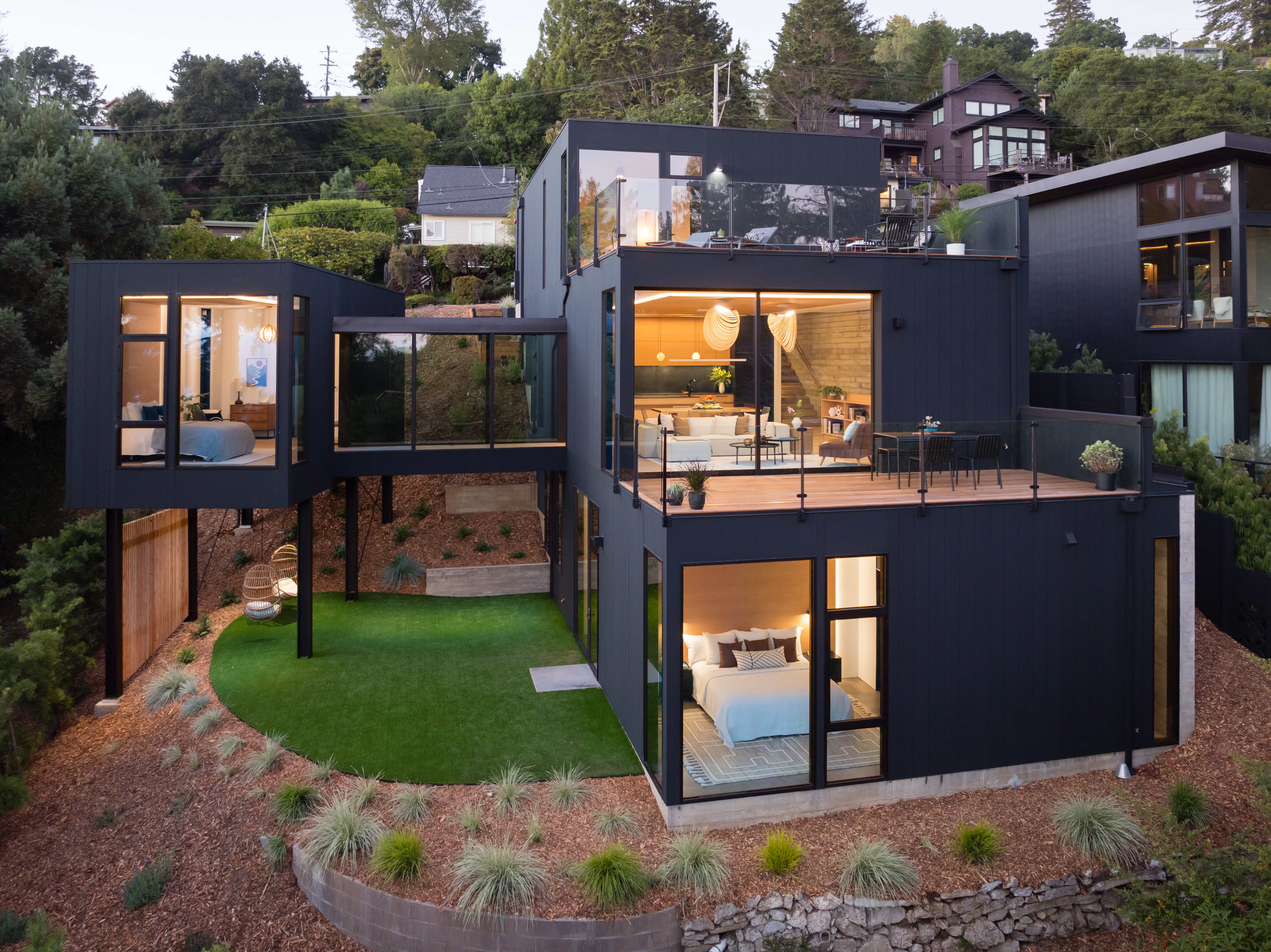 Separating the nest, at left, from the rest of the house had the added benefit of giving more definition to the yard below. (Peter Lyons)