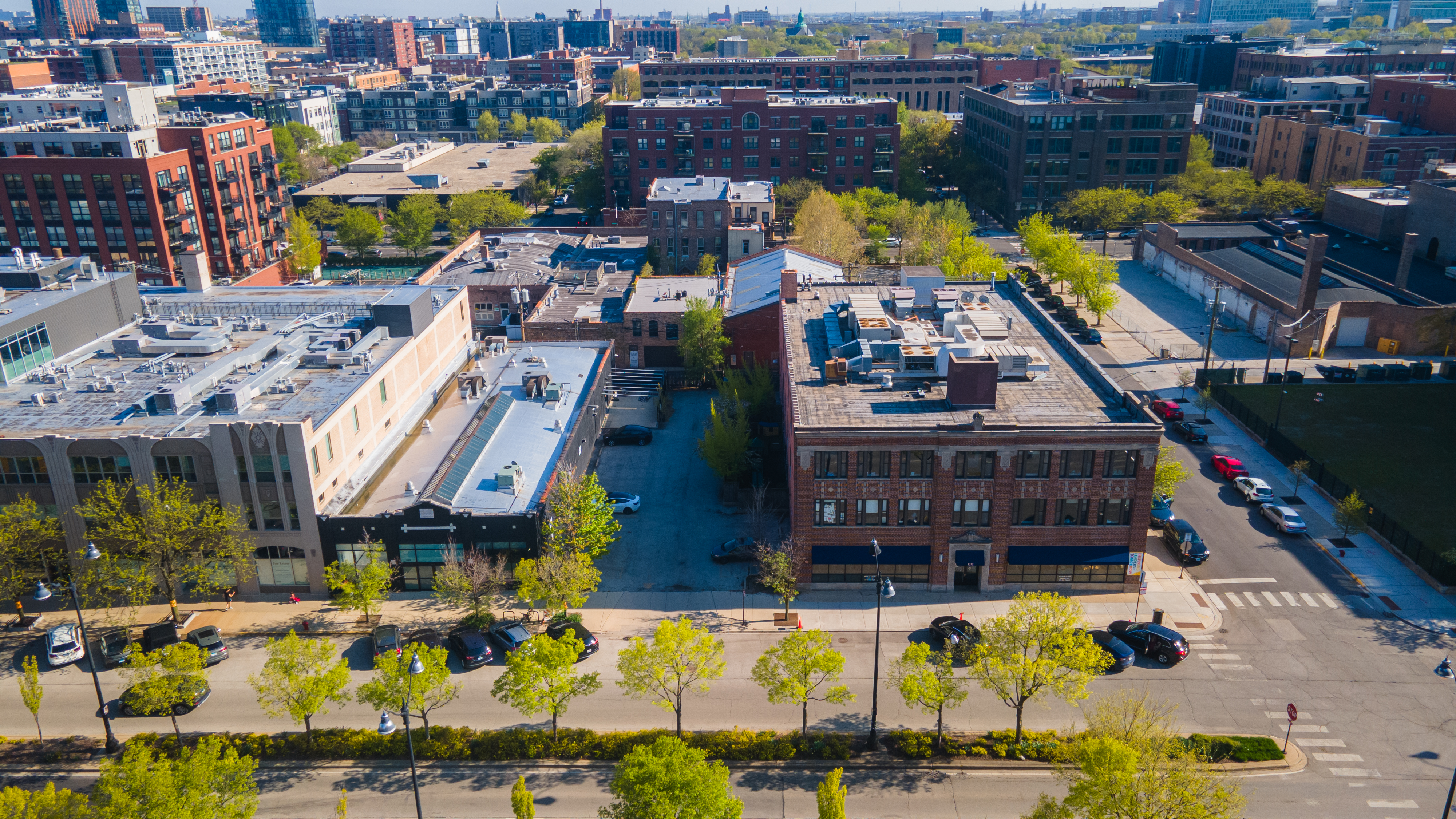A development site at 1325 W. Randolph St. in Chicago, which includes a loft building and a parking lot, is for sale for $8 million. (SVN Chicago)