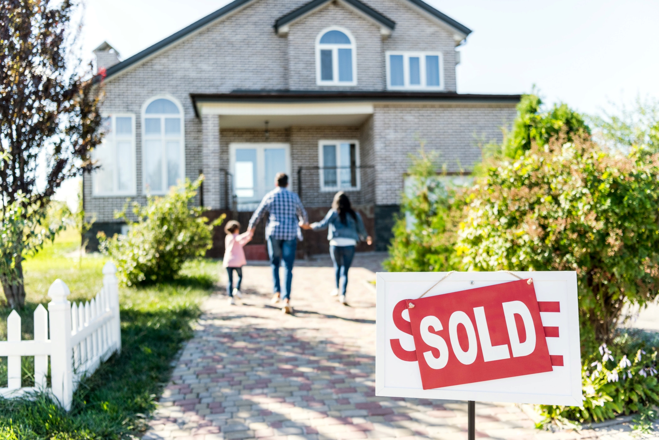 Home prices remain well above year-ago levels in many regions, but the rate of price growth slowed in the third quarter. (Getty Images)