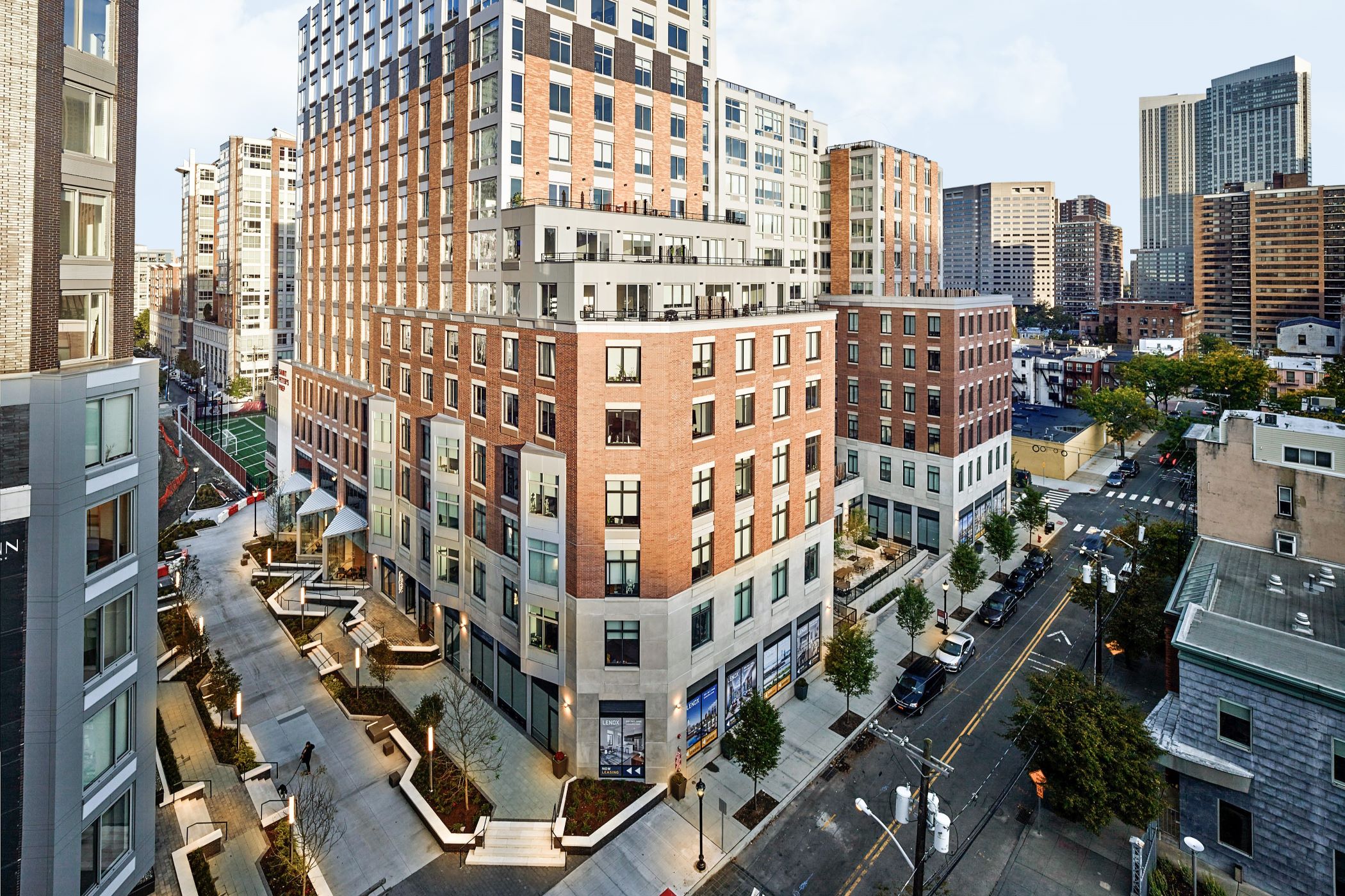The Lenox apartment property has 255 units and includes a 257-space automated parking garage. (CBRE)
