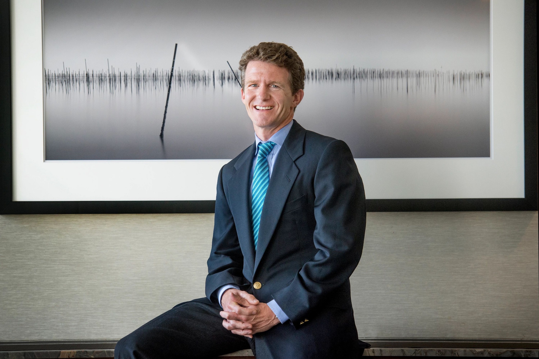 Walker & Dunlop CEO Willy Walker said his firm could pick up new business as banks clamp down on lending for multifamily properties. (Getty Images)