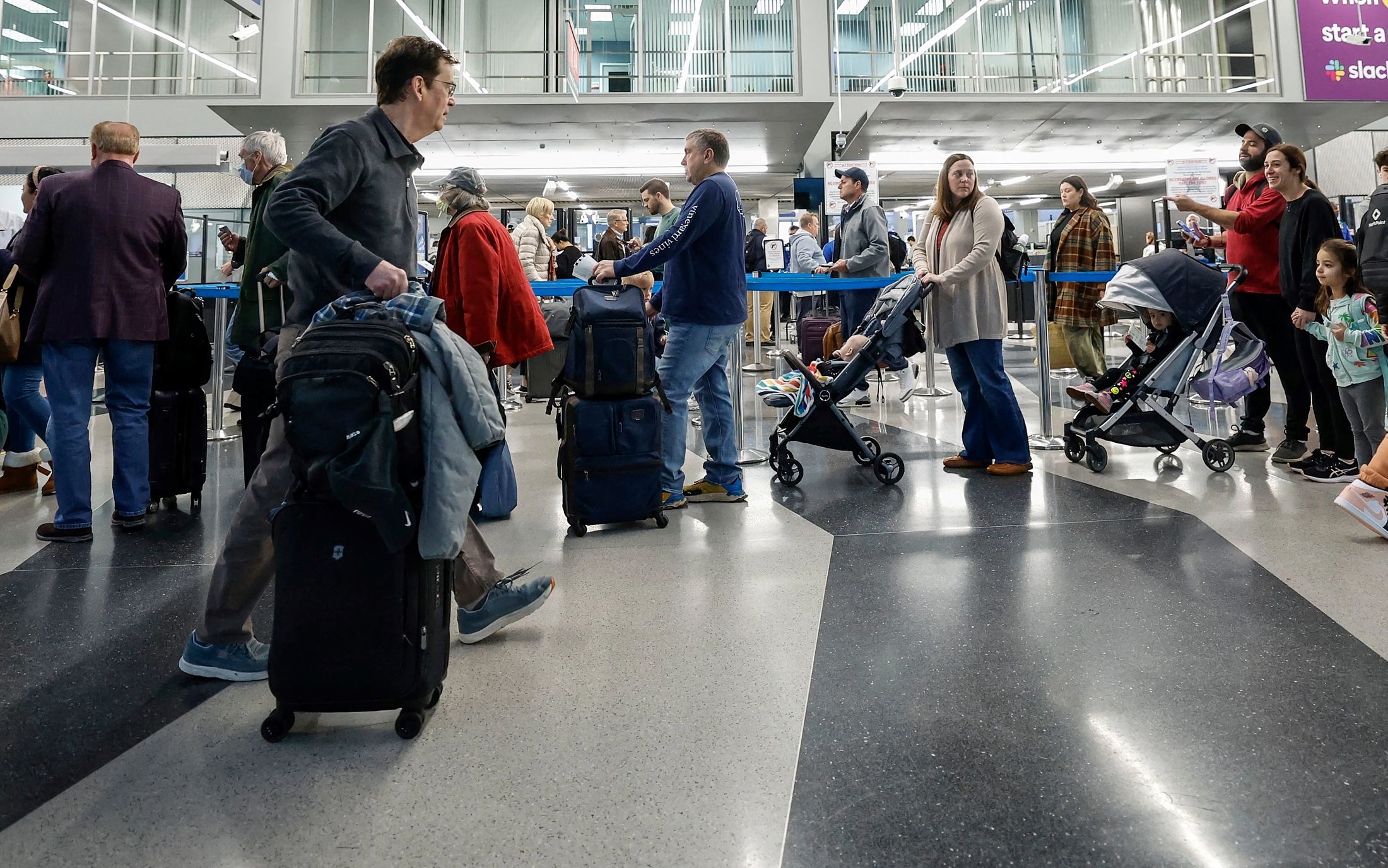 Elevated costs for everyday items are spurring consumers to cut back on vacation travel spending, according to national surveys. (Getty Images)