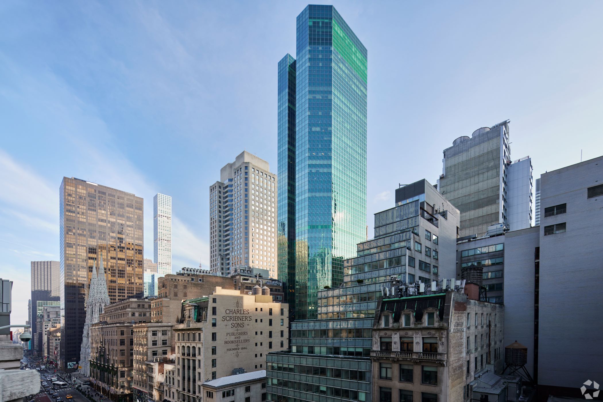 WeWork has rejected its headquarters lease at 12 E. 49th St., the blue-green glass tower at center, in New York. (CoStar)