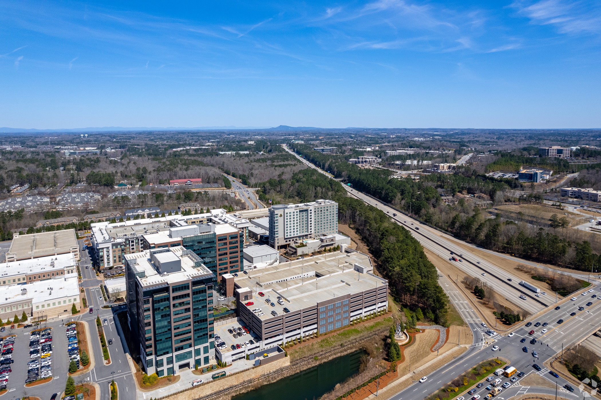 Jamestown will acquire the property management services subsidiary of North American Properties. NAP's portfolio includes the Avalon mixed-use development near Atlanta, pictured. (CoStar)