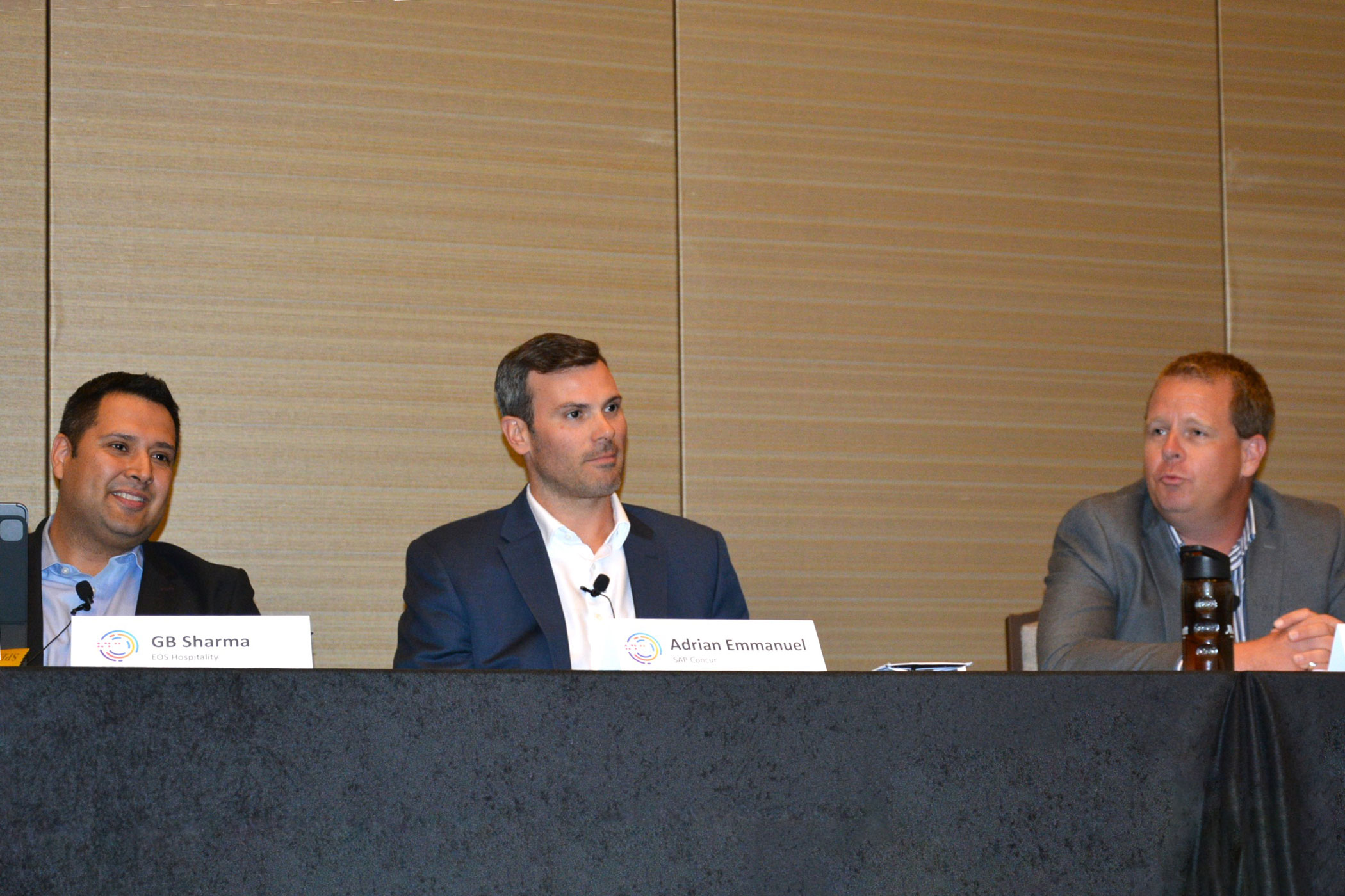 From left: Gaurav Sharma, of EOS Hospitality; Adrian Emmanuel, of SAP Concur; and John Cook, of Marriott International, participate in a panel about business travel at the Hotel Data Conference. (Terence Baker)