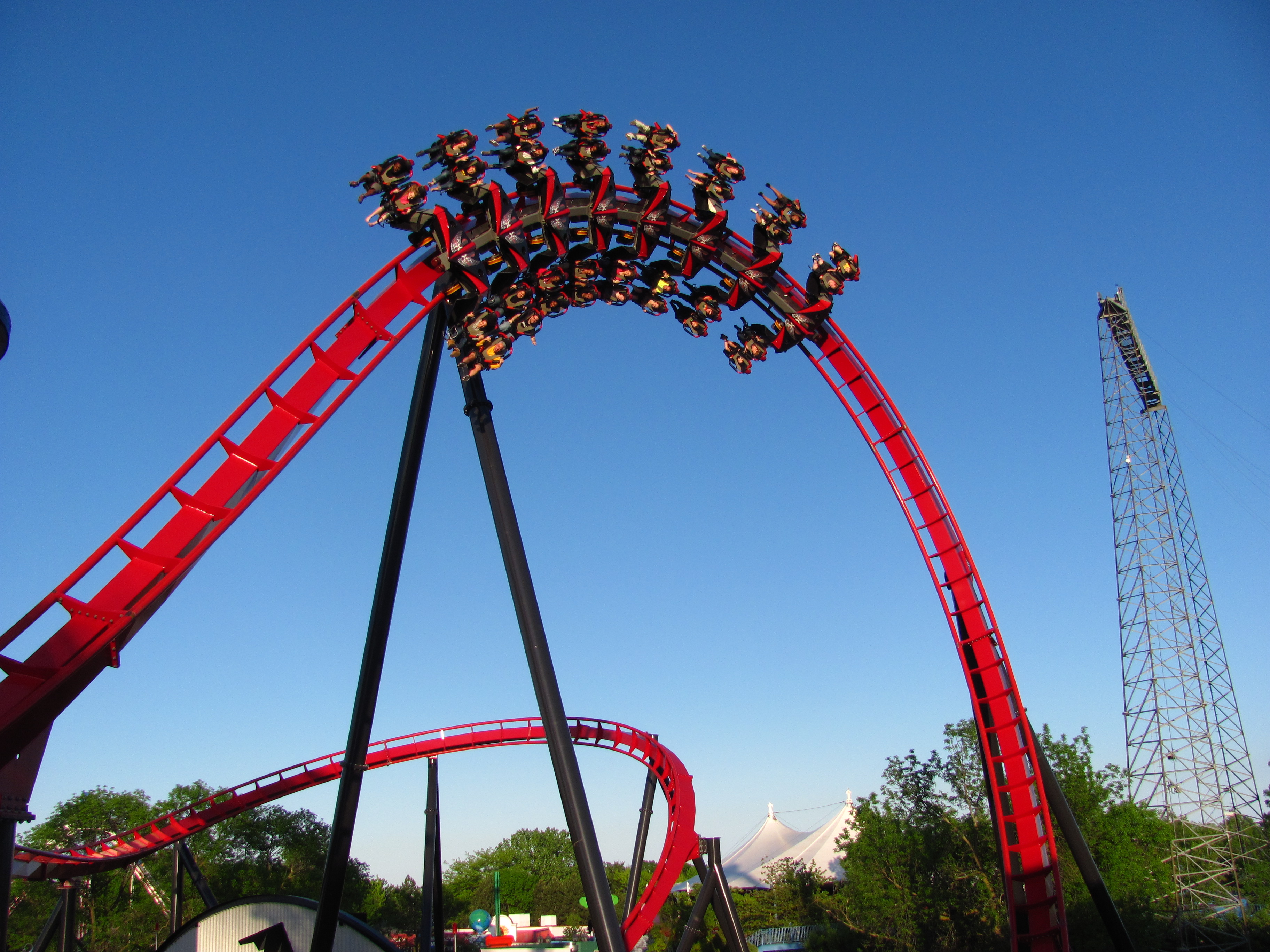 A Six Flags roller coaster turns amusement park goers around on a ride. (Jeremy Thompson/Flickr)