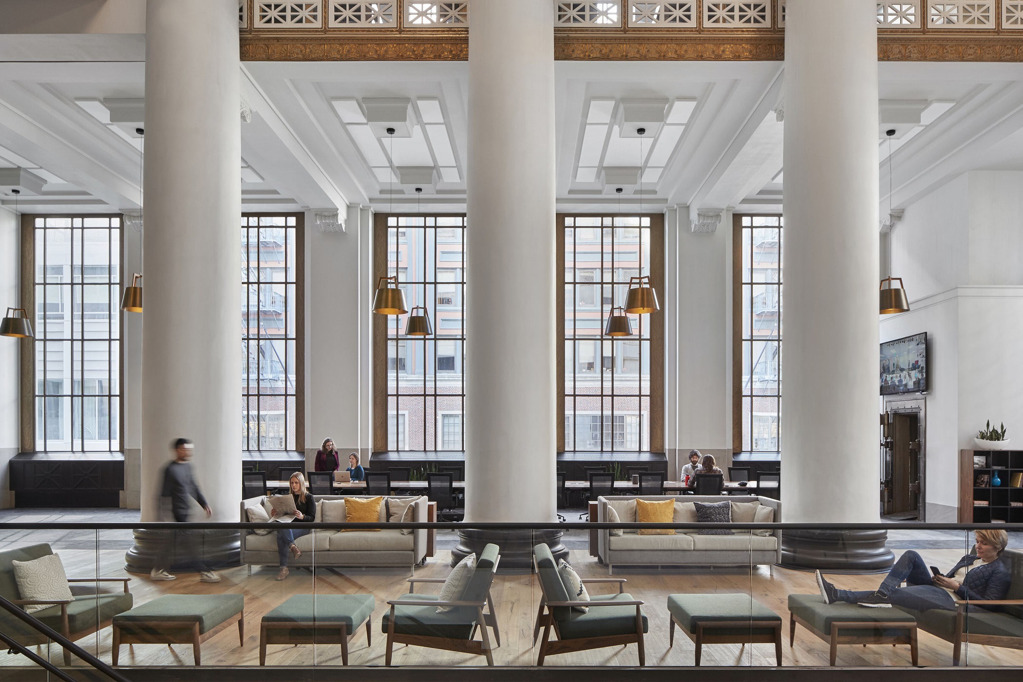 ZGF Architects' renovation of the Expensify office in Portland, Oregon, includes a library where workers are asked to refrain from audio and video calls and large group meetings, creating an atmosphere for getting work done. (Garrett Rowland)