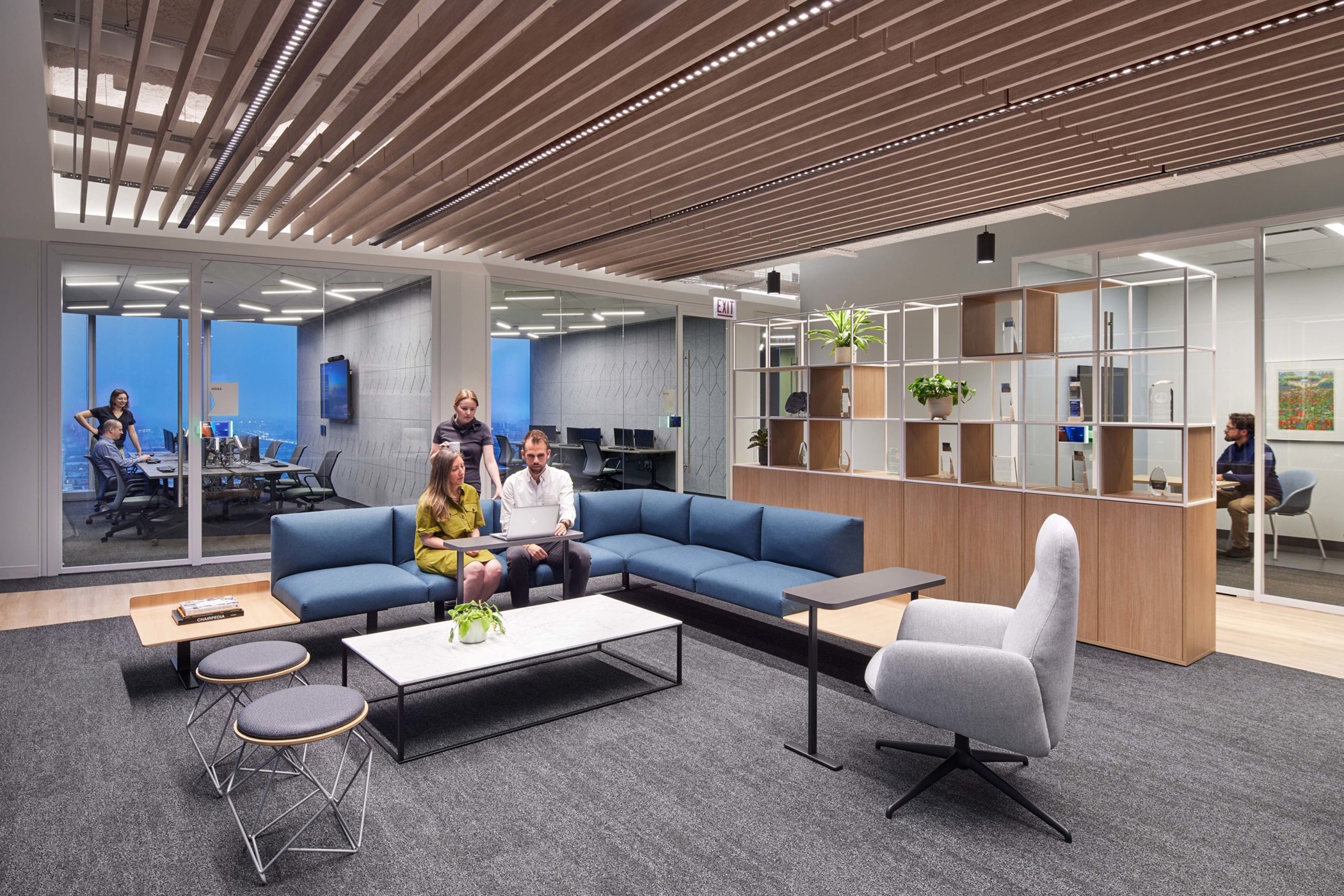 Nelson Worldwide's design for the National Futures Association headquarters in Chicago includes living room-style areas with sofas, bookshelves and a coffee table. (Corey Gaffer/Nelson Worldwide)