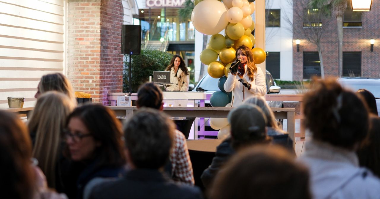 Choate Construction executive Quinn Balderson, with microphone, speaks at the firm's recent annual Women in Industry Kick-Off event near Charleston, South Carolina. (Choate Construction)