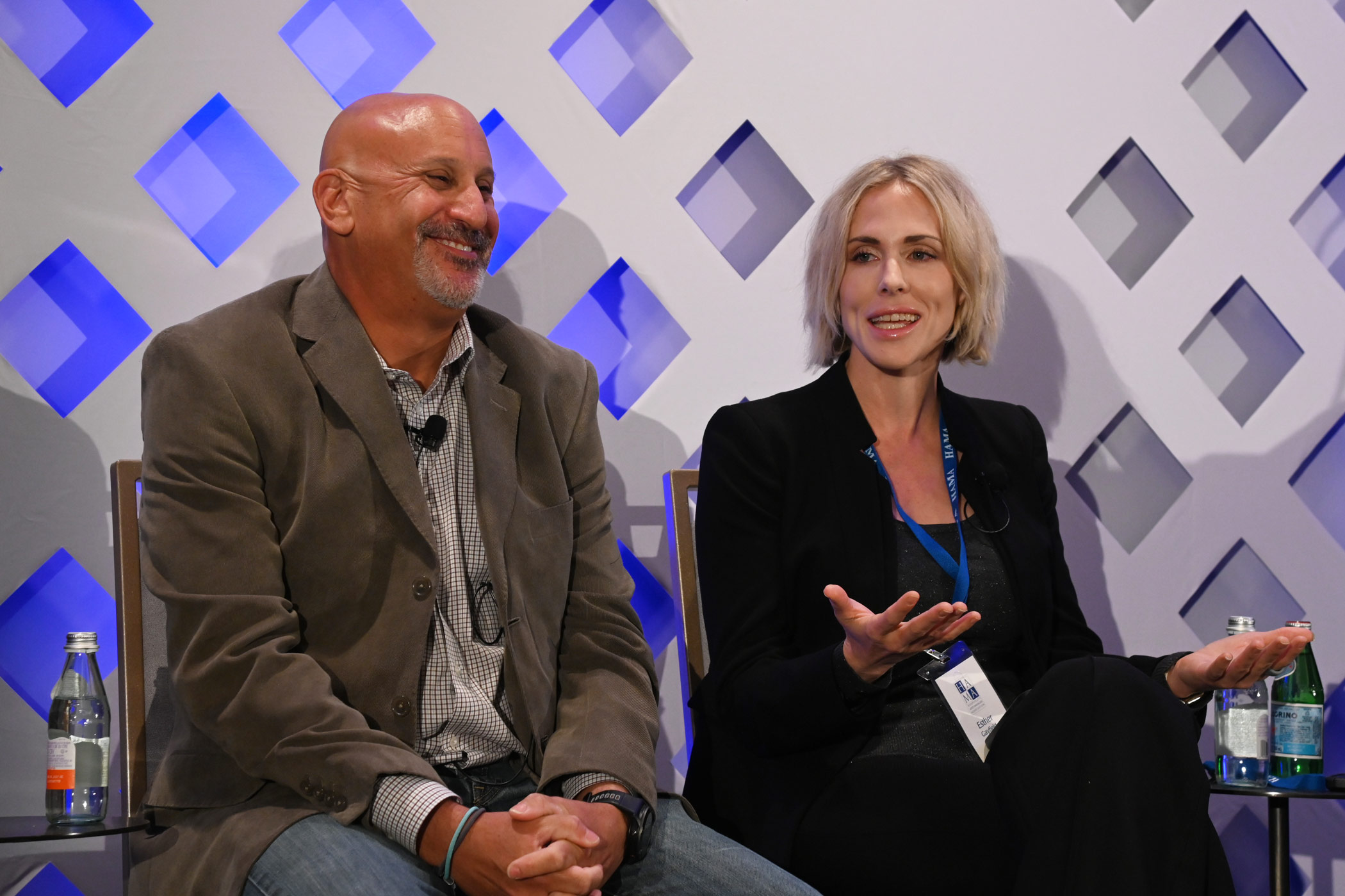 Esther Gayfield, of Highgate, right, speaks along side Marc Dober, most recently at Cerberus Capital Management on a panel about select-service hotels at the recent Hospitality Asset Managers Association conference. (Bryan Wroten)