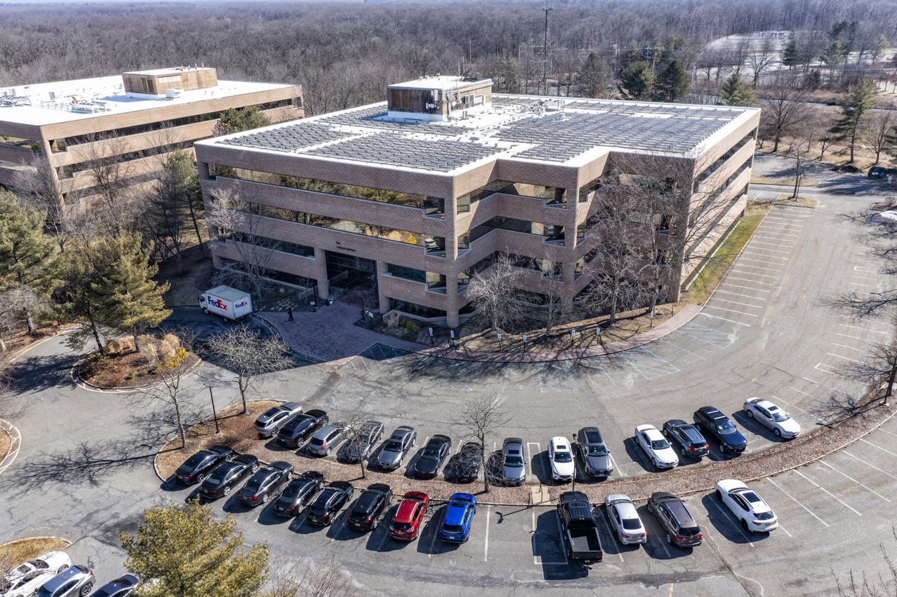 The four-story office building that just sold is in an office park in Warren, New Jersey. (Cushman & Wakefield)