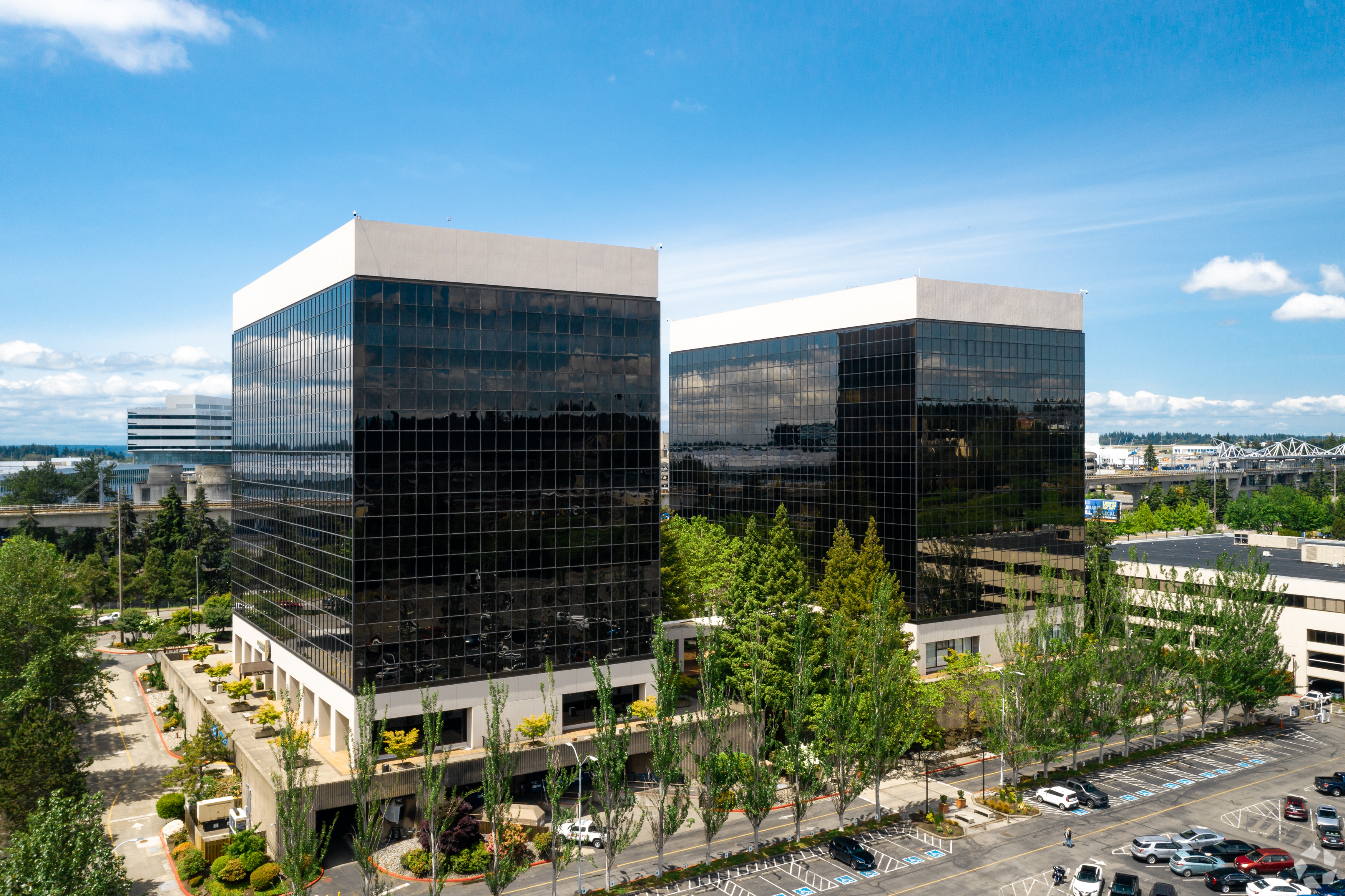 International Place includes two 12-story towers and a low-rise office building on International Boulevard in SeaTac. (CoStar)