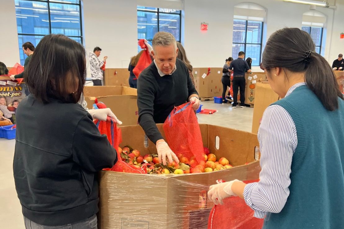 Some 50 GIC employees packed food for City Harvest, a group that redirects food to people in need. (Courtesy of Katy Conrad)