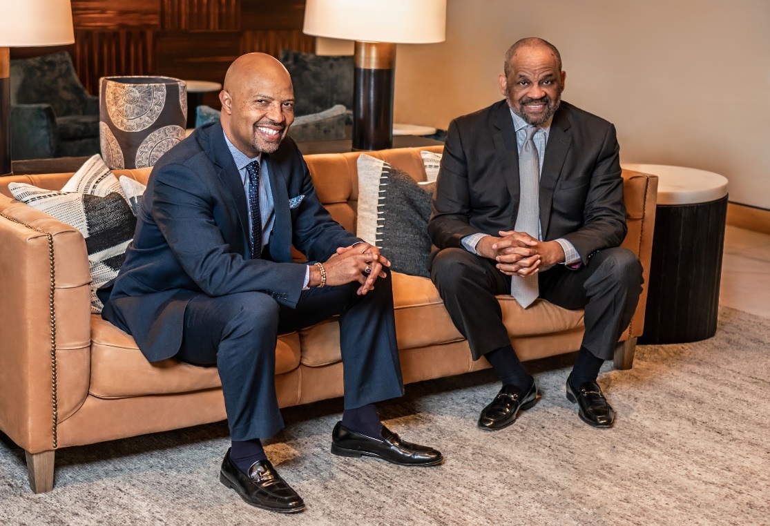 Landon Taylor, left, will lead the real estate company founded by Victor MacFarlane, right. (MK Visuals Photography)