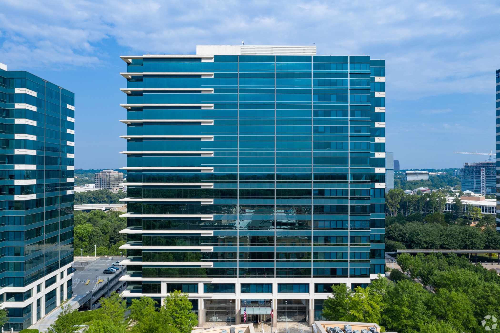 Insurance provider AIG will lease seven floors at the Summit Two office tower in suburban Atlanta and get signage rights on top of the building. (CoStar)