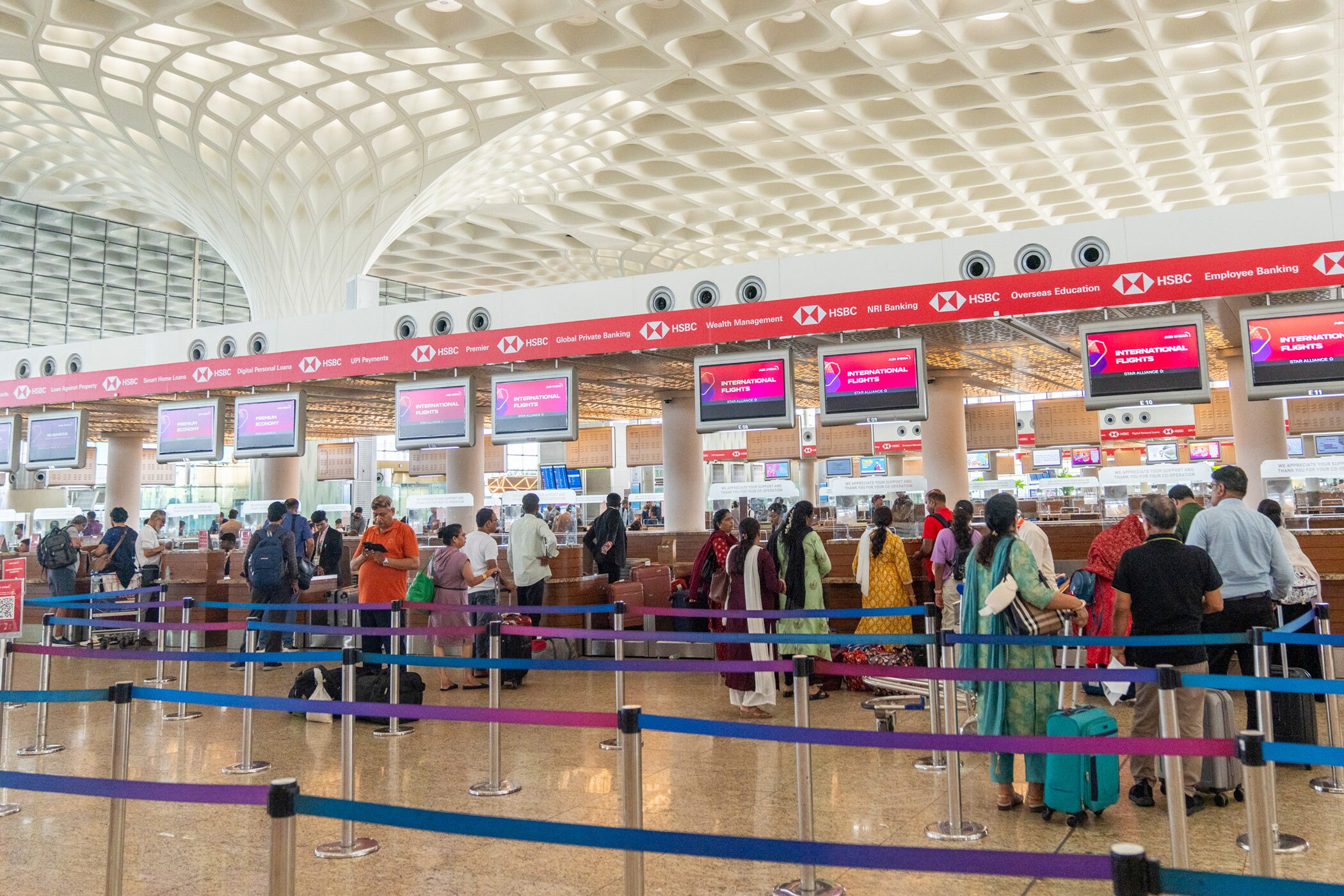 Passengers line up at check-in counters at Chhatrapati Shivaji Maharaj International Airport in Mumbai. India has posted significant growth in outbound travel. (Bloomberg via Getty Images)