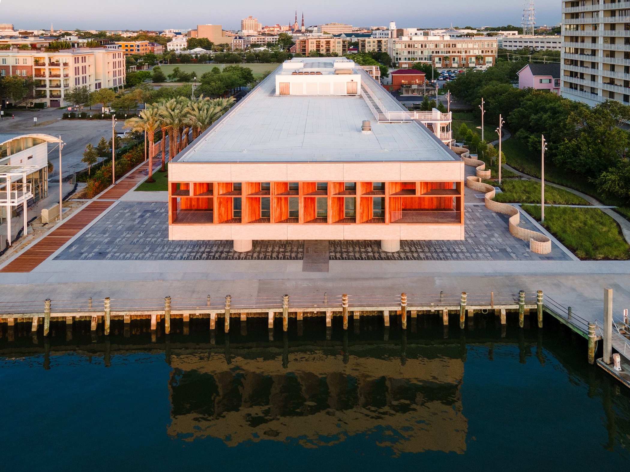 Architects designed the International African American Museum to be lifted off the ground to preserve the site where slaves arrived in North America. (Moody Nolan and Pei Cobb Freed & Partners)