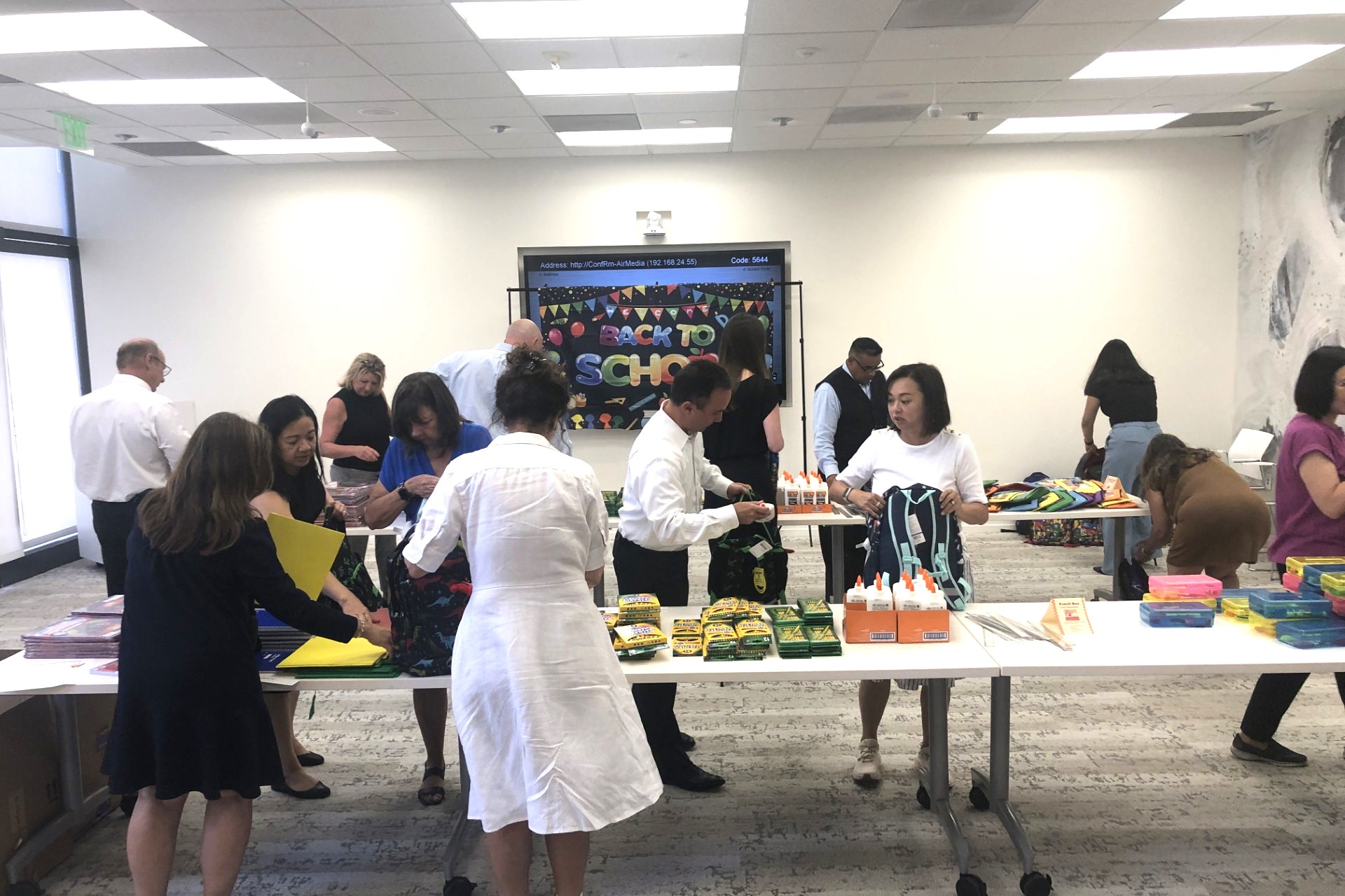 KBS Realty Advisors employees package school supplies and backpacks for students in California. (KBS Realty Advisors)