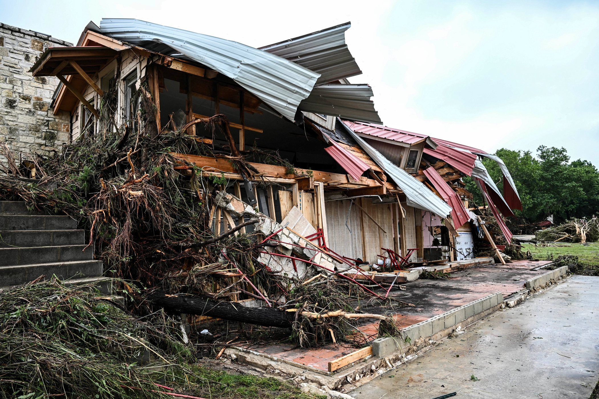 Damage could top $20 billion after deadly floods destroyed homes and other properties in Central Texas. (Ronaldo Schemidt/AFP via Getty Images)