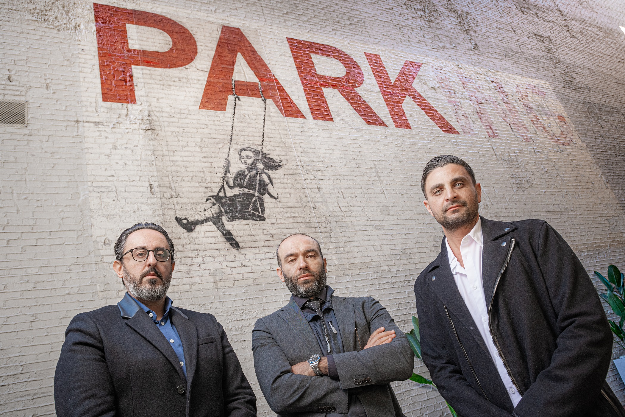 Salar Hendizadeh, Farid Yaghoubtil and Daniel Azizi are partners of Downtown LA Law Group and now own the building at 908-910 S. Broadway that features the Banksy mural 