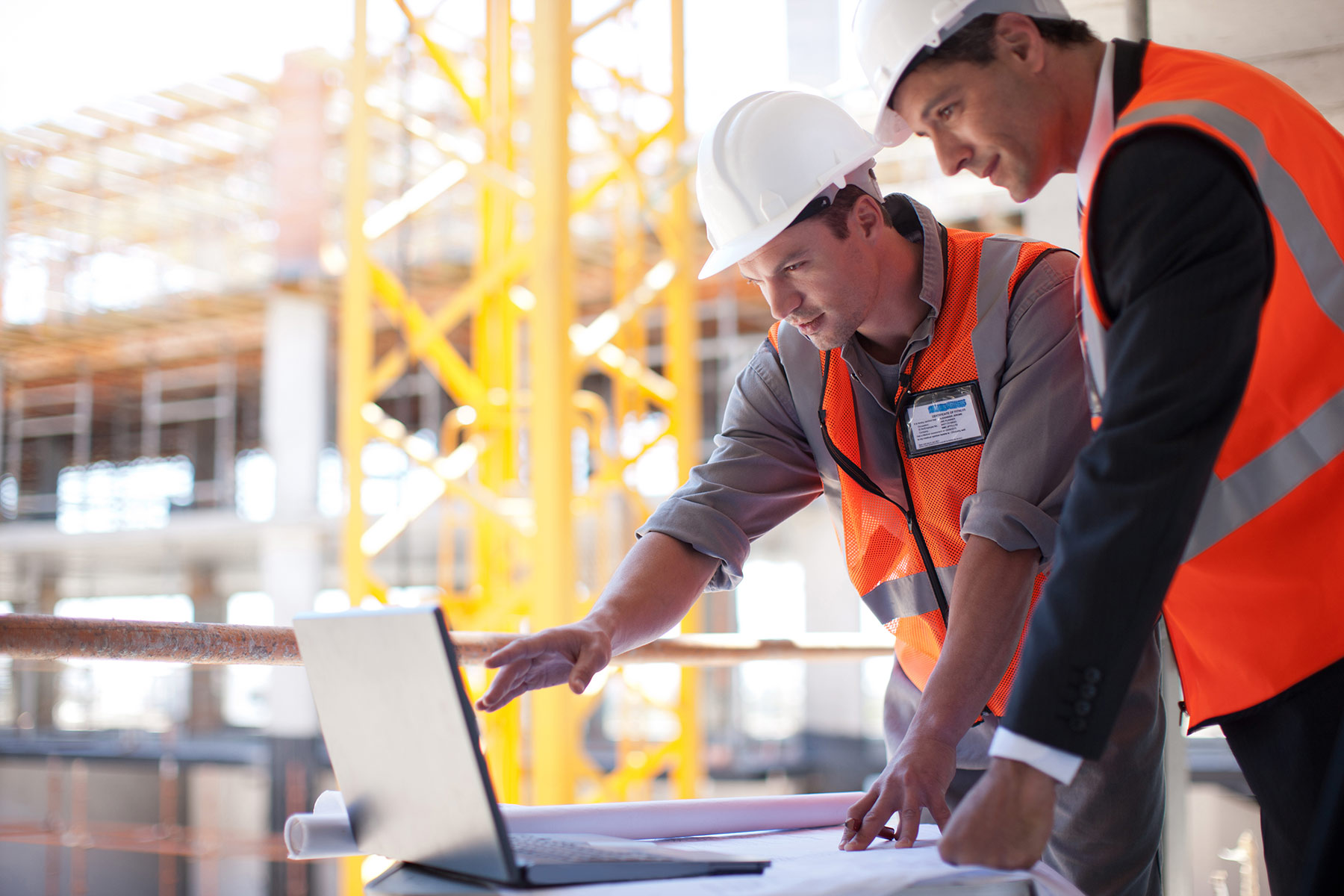 Construction workers go over plans for a new project. Tristar Business Park is expected to have two buildings located near Dallas-Fort Worth International Airport. (File Photo / iStock)