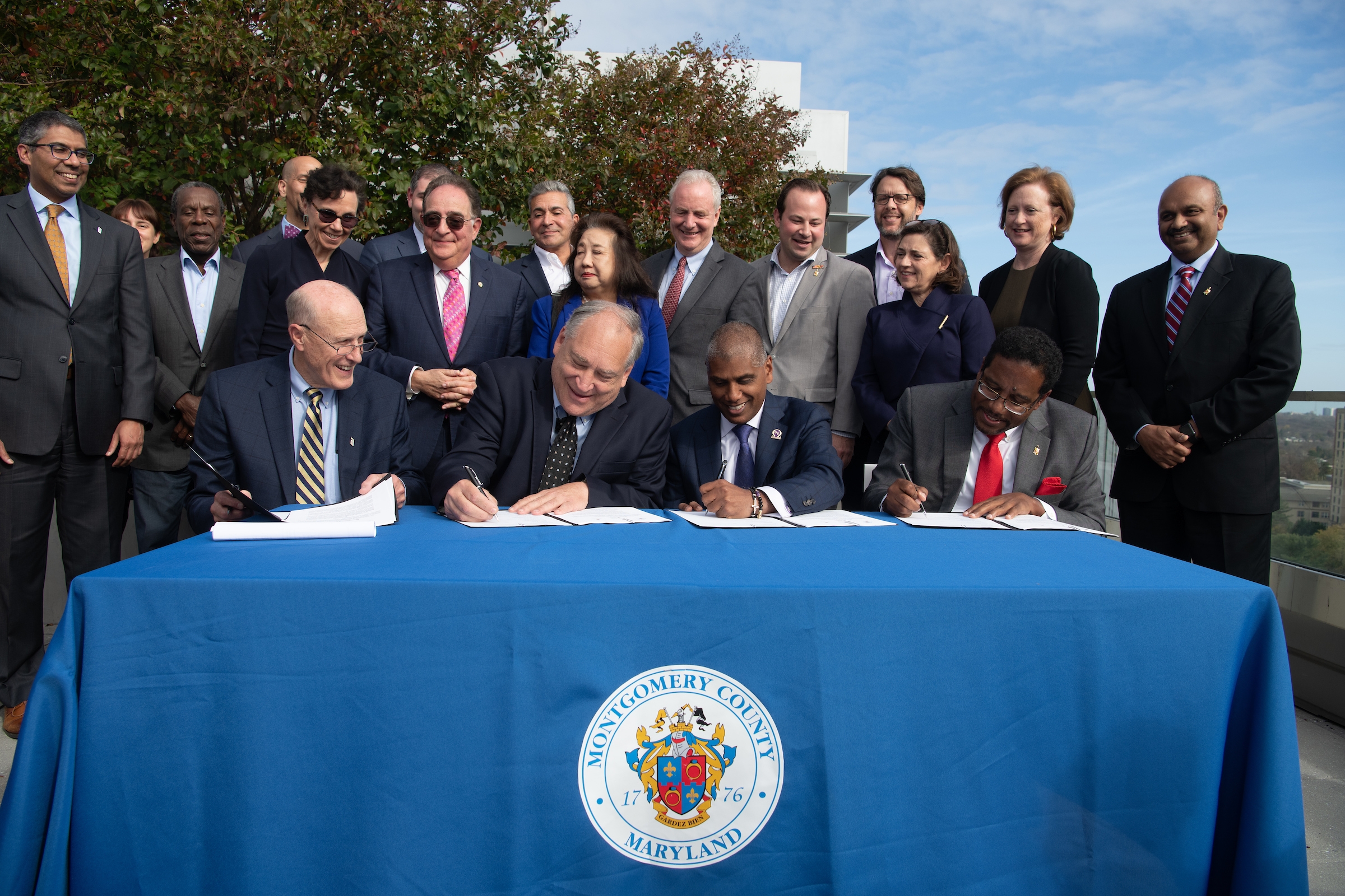 From left: University of Maryland, Baltimore President Bruce Jarrel; Montgomery County Executive Marc Elrich; president and CEO of the University of Maryland Medical System Mohan Suntha; and University of Maryland, College Park President Darryll Pines sign a memorandum of understanding to establish a health institute in North Bethesda, Maryland. (University of Maryland, Baltimore)
