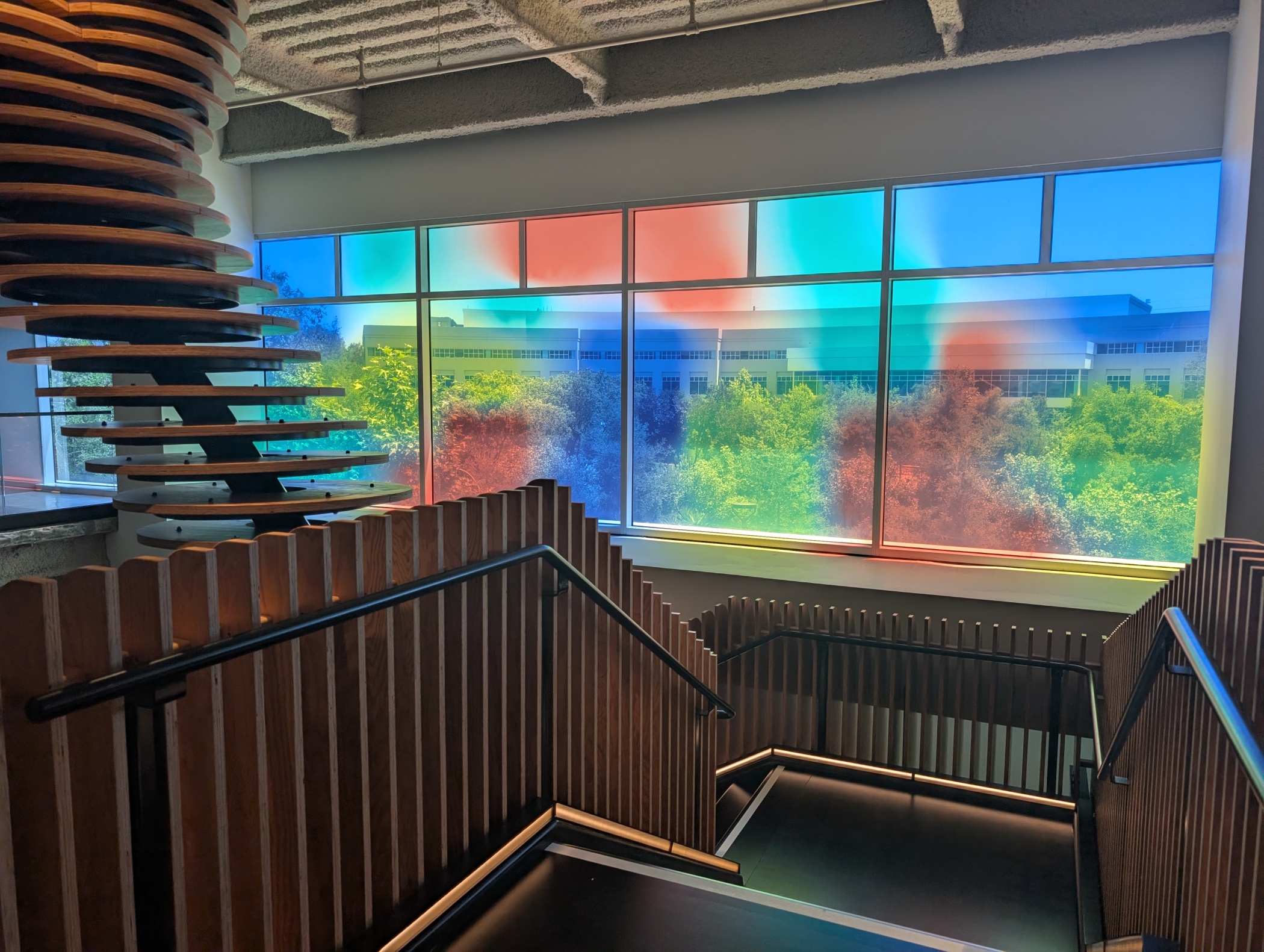 A window reflecting Google's trademark rainbow hues is one of the visual touches at the Meadow Point campus. (Rachel Scheier/CoStar)