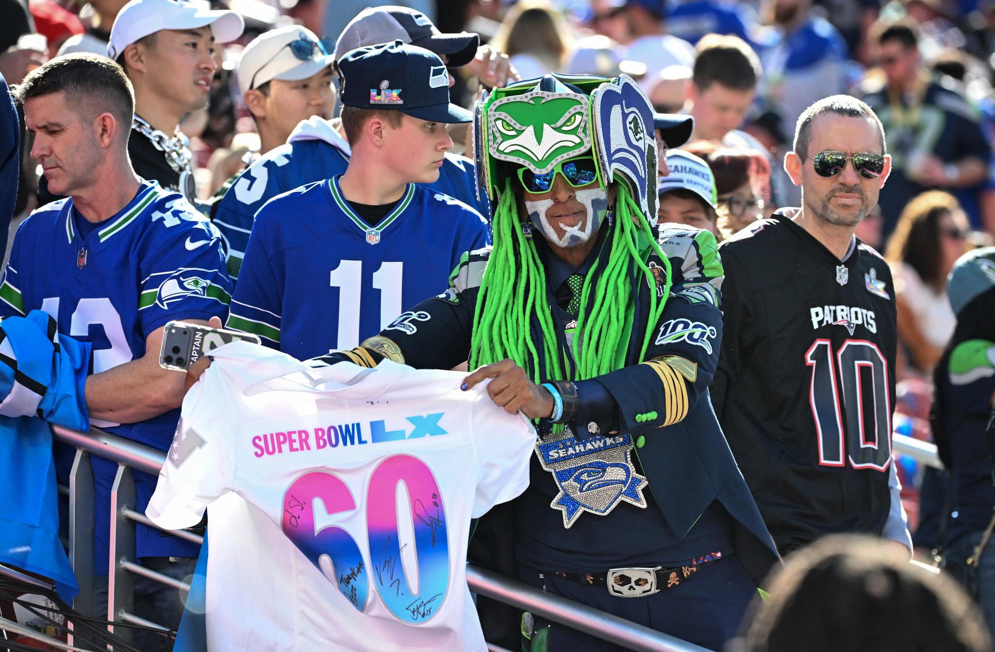 A Seahawks fan waves a shirt ahead of Super Bowl LX between the New England Patriots and the Seattle Seahawks at Levi's Stadium in Santa Clara, California on February 8, 2026. (Photo by JOSH EDELSON / AFP via Getty Images) (AFP via Getty Images)