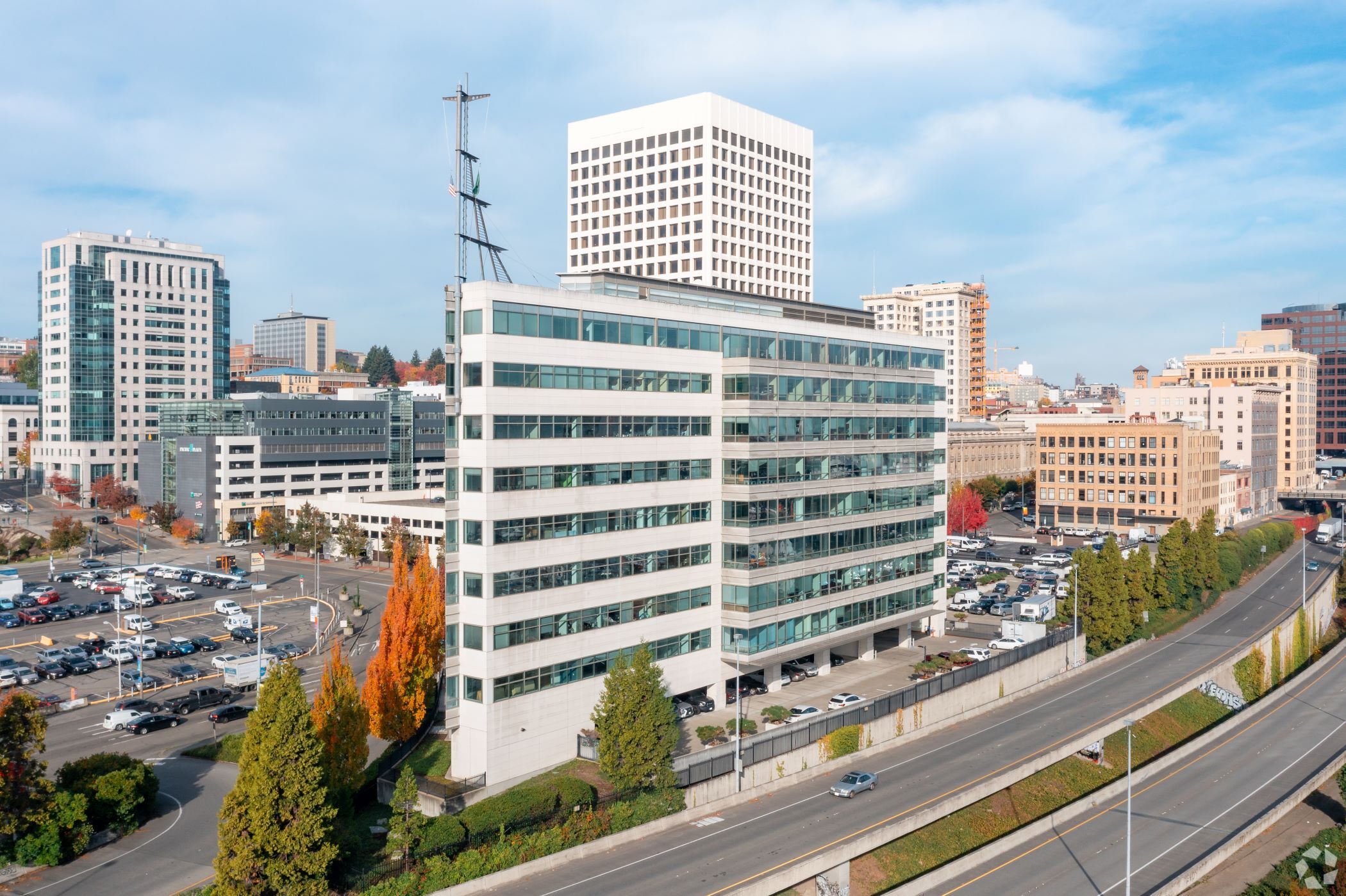 The December sale of the Columbia Bank Center, foreground, is now Tacoma's all-time biggest office deal, followed by another recent deal involving the Tacoma Financial Center, the blue and white tower to the left. (CoStar)