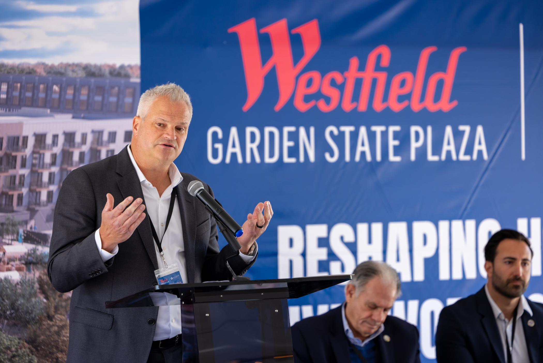 Dominic Lowe, chief operating officer of Unibail-Rodamco-Westfield in the United States, speaks at the groundbreaking for the first phase of the redevelopment of Westfield Garden State Plaza. Bergen County Executive Jim Tedesco and Paramus Mayor Christopher DiPiazza are to his side, left to right. (Unibail-Rodamco-Westfield) 