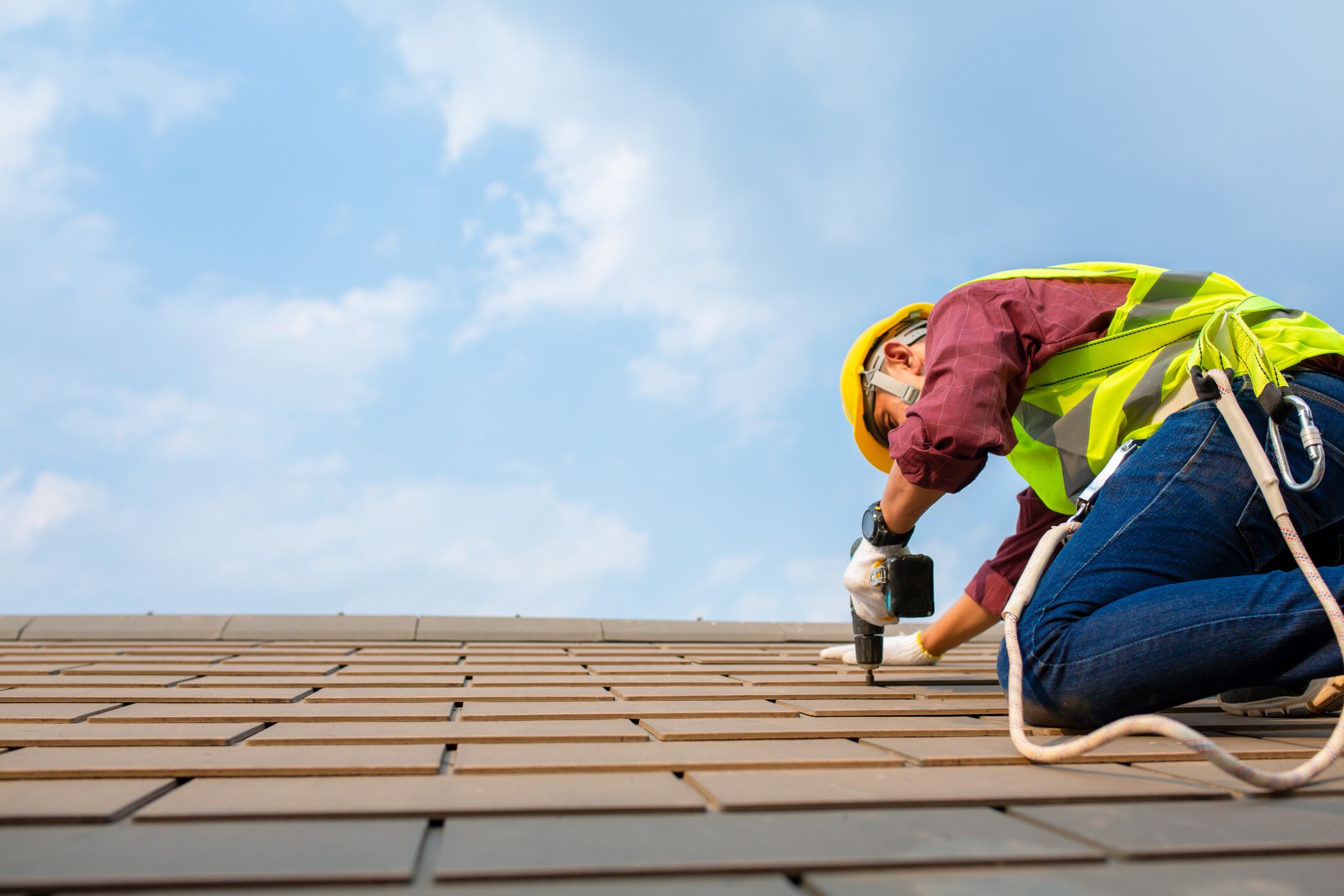 A construction worker nails shingles into the roof of a house. The nation's largest homebuilder D.R. Horton told investors they are seeing buyer demand for more affordable homes as elevated interest rates drive up borrowing costs. (Getty Images) A construction worker nails shingles into the roof of a house. The nation's largest homebuilder D.R. Horton told investors they are seeing buyer demand for more affordable homes as elevated interest rates drive up borrowing costs. (Getty Images)