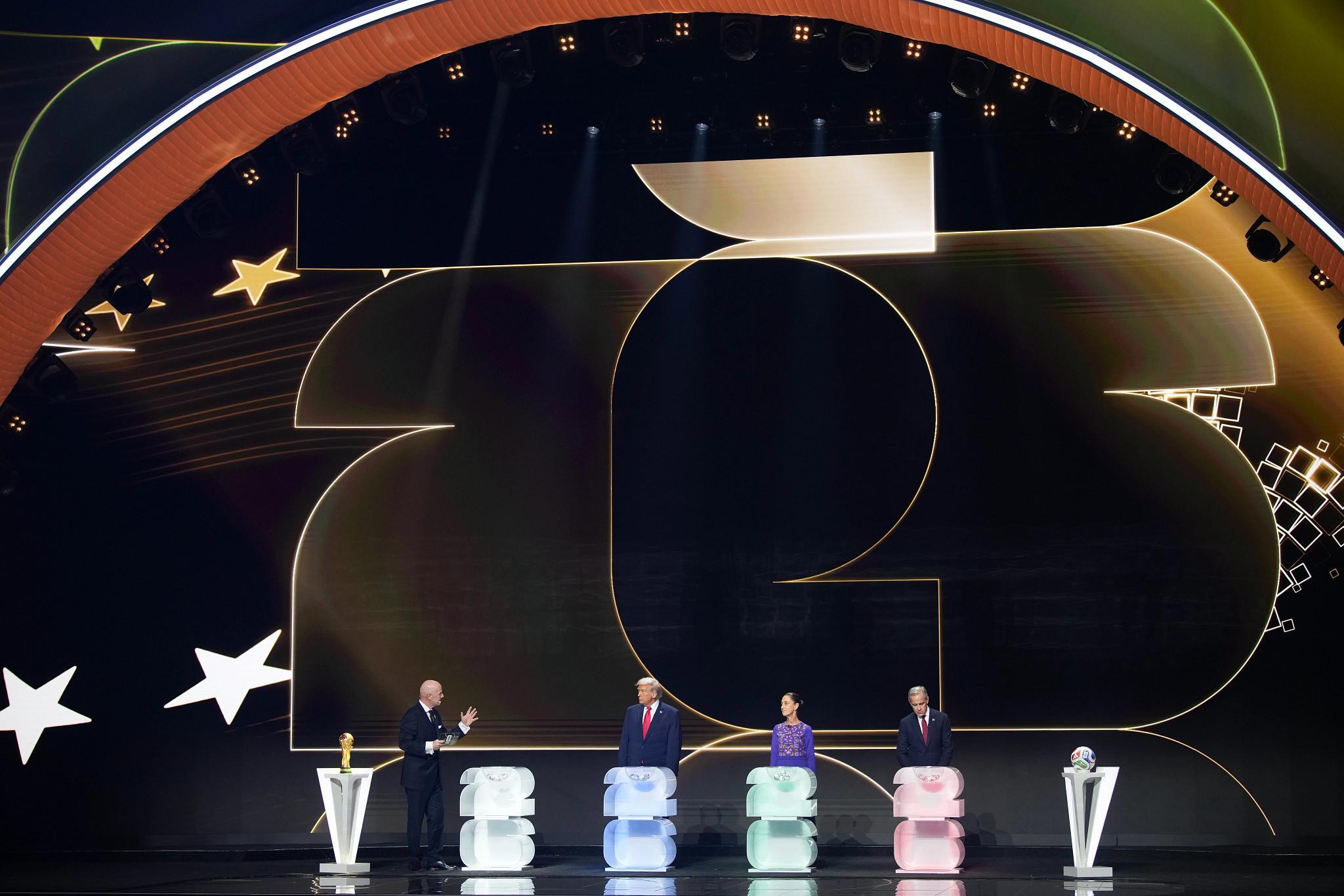 WASHINGTON, DC - DECEMBER 05:  FIFA President Gianni Infantino (L) speaks during the FIFA World Cup 2026 Official Draw with (L-R) U.S. President Donald Trump, Mexican President Claudia Sheinbaum, and Canadian Prime Minister Mark Carney at the John F. Kennedy Center for the Performing Arts December 05, 2025 in Washington, DC.  The 2026 FIFA World Cup will take place between June 11 and July 19 featuring 48 teams with matches being played in the United States, Mexico and Canada, the first time the international sporting event will be hosted by three nations.  (Photo by Andrew Harnik/Getty Images) (Getty Images)