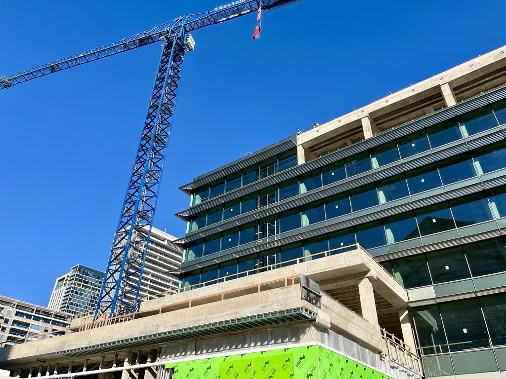 The construction, as seen from the sidewalk, surrounding the expansive office campus. (Candace Carlisle/CoStar)