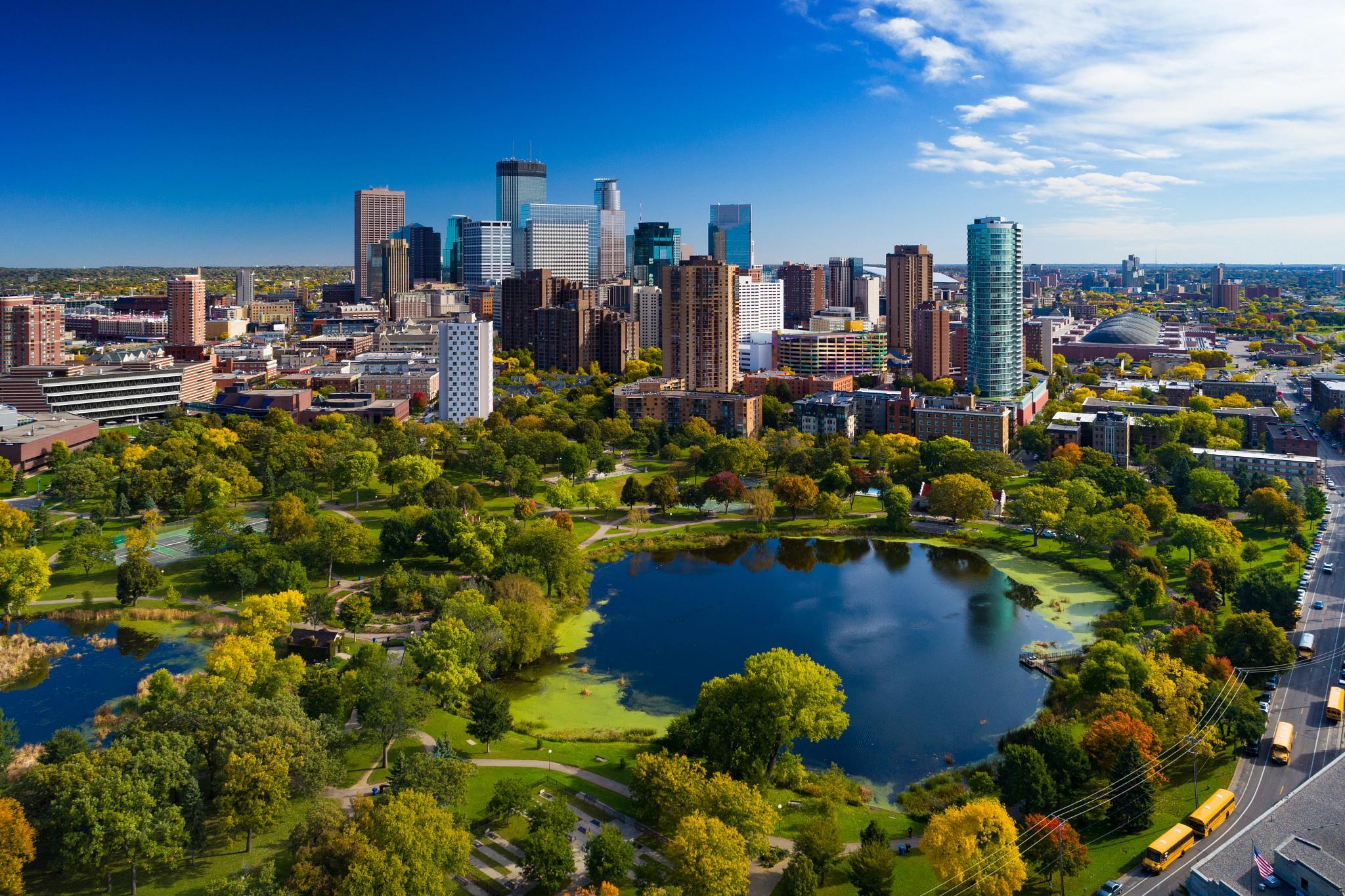Minneapolis aerial with Downtown Minneapolis skyline in the background and Loring Park with Loring Pond in the foreground, during early autumn. (Getty Images)
