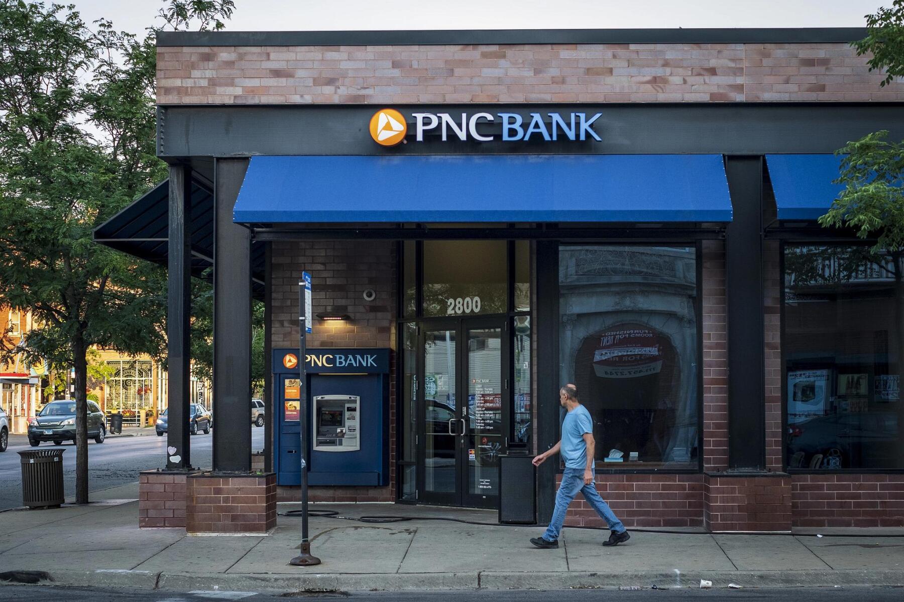 A pedestrian passes in front of a PNC Financial Services Group Inc. bank branch in Chicago, Illinois, U.S., on Thursday, July 12, 2018. PNC Financial Services Group Inc. is scheduled to release earnings figures on July 13. Photographer: Christopher Dilts/Bloomberg via Getty Images (Getty Images)